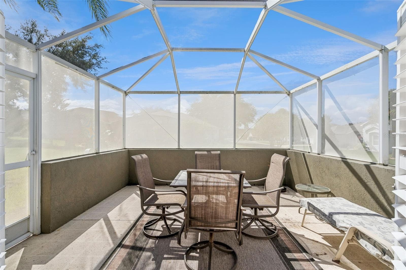 Larger screened lanai - 13.5 X 13.4 - with room to dine and relax. - 4900 CANOE CT, TAVARES