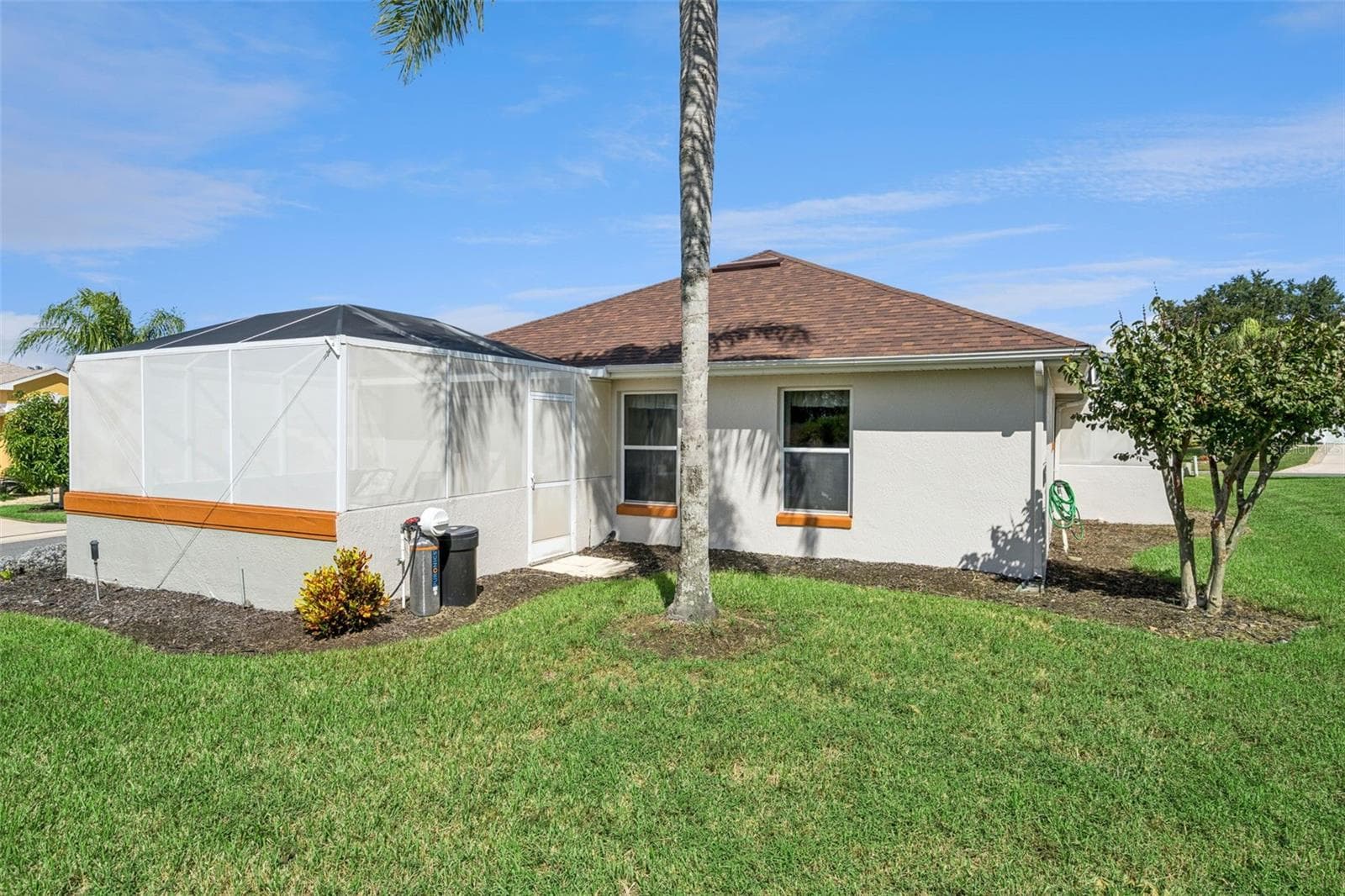 Screened lanai from the side yard. - 4900 CANOE CT, TAVARES