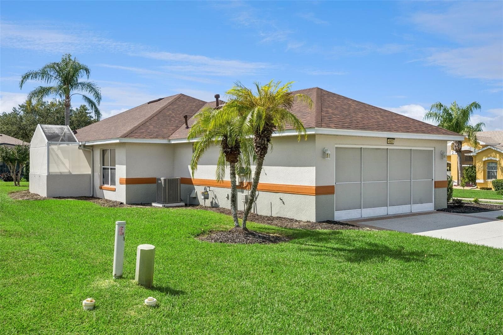 Back yard from the garage side of the home. - 4900 CANOE CT, TAVARES