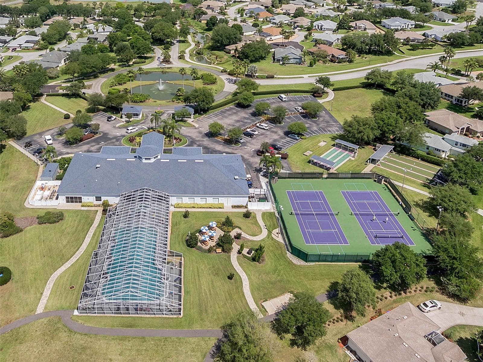Clubhouse, pool, courts and walking paths. - 4900 CANOE CT, TAVARES