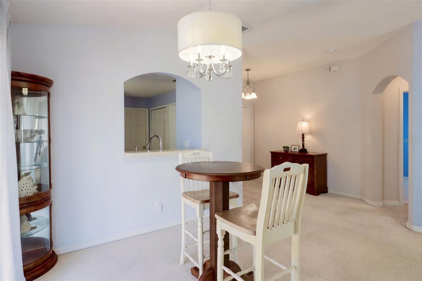 Formal Dining Room with Custom Light Fixture - 3437 GRENVILLE DR, WINTER HAVEN