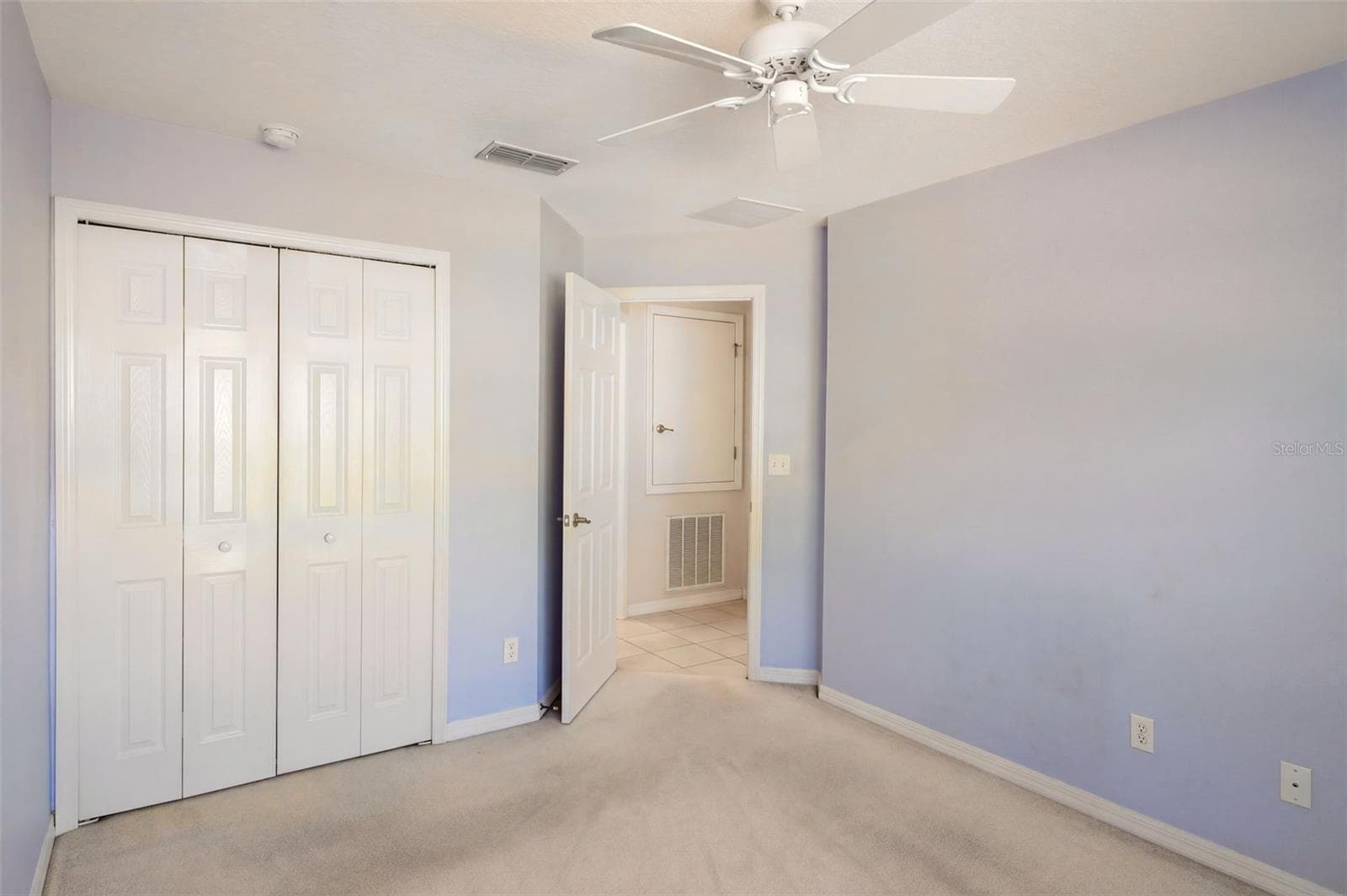 Guest bedroom features a ceiling fan - 3437 GRENVILLE DR, WINTER HAVEN