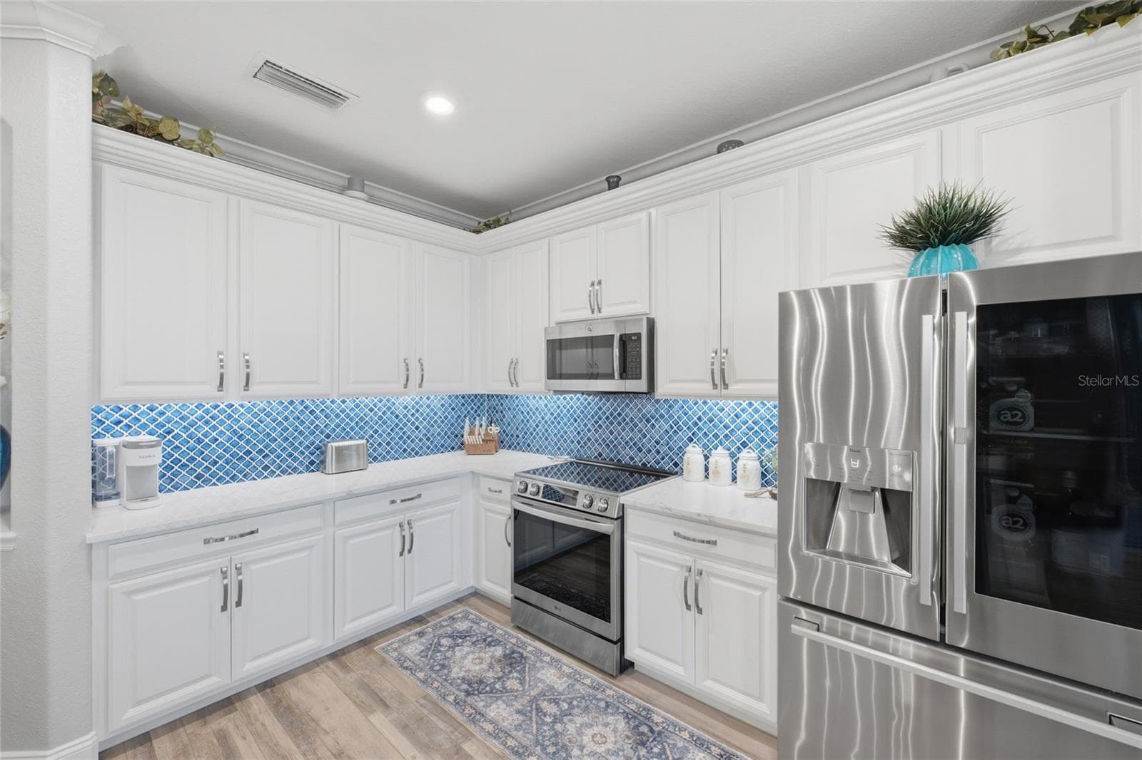 Kitchen with Stainless Steel Appliances - 6726 ROOKERY LAKE DR, BRADENTON