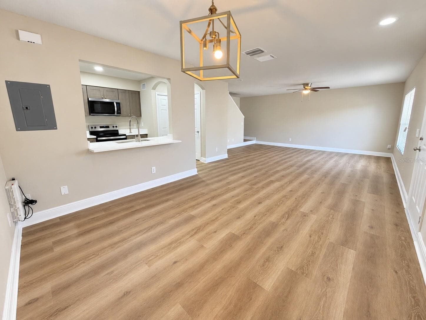 Living / Dining Room - New Flooring and Fresh Paint - 7338 E BANK DR, TAMPA