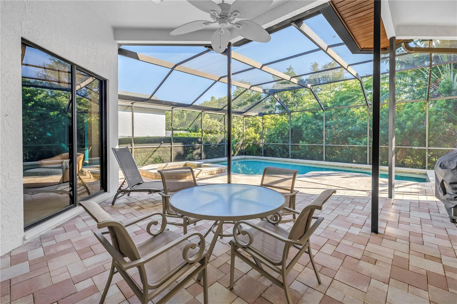 Featuring a fully covered outdoor living area and a private backyard perfect for entertaining. - 1186 GASPARILLA DR NE, ST PETERSBURG