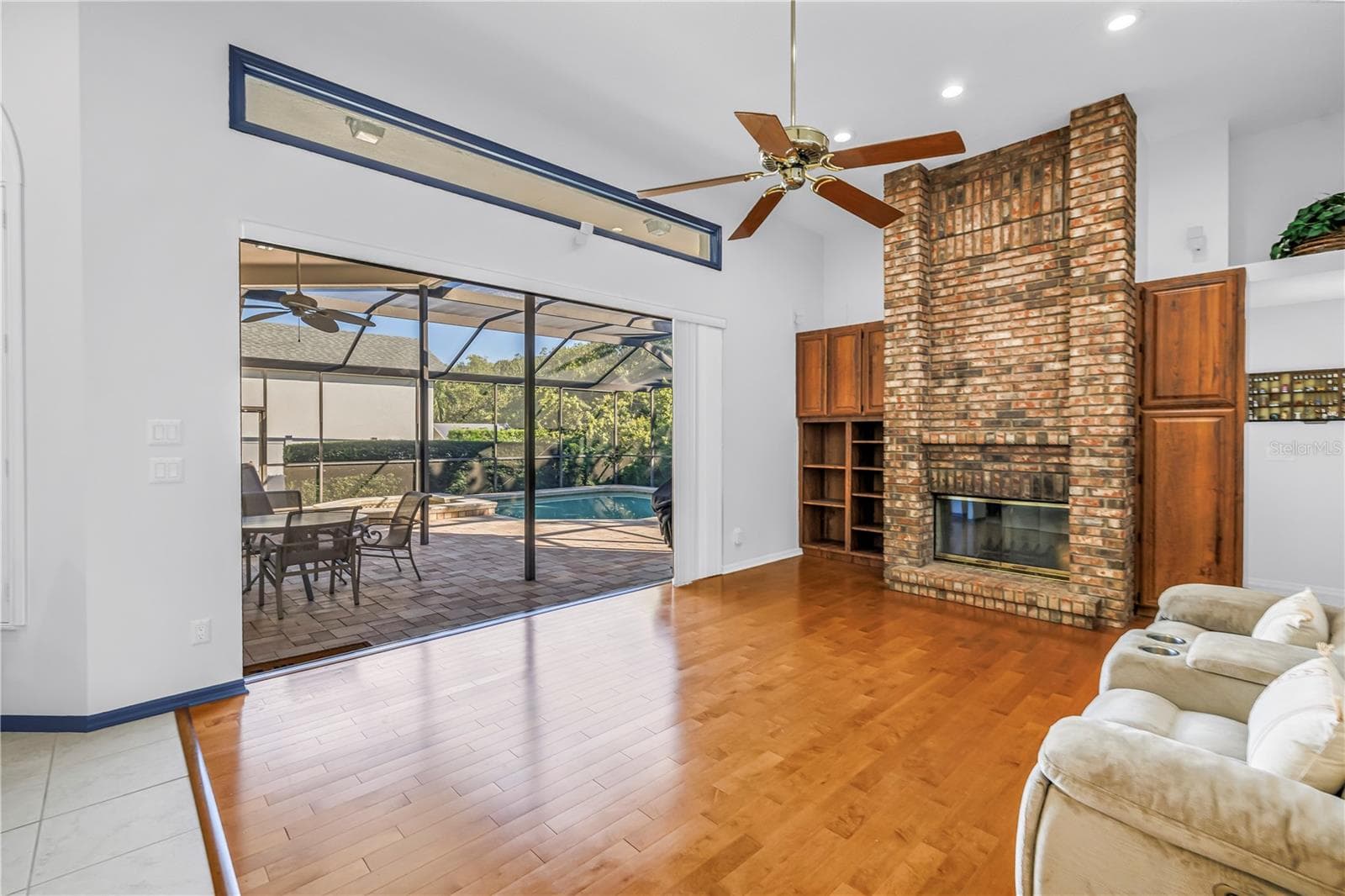 12 Foot ceilings in this open Great Room with Triple 8-Ft Sliders which pocket and open the inside to the outside. Literally amazing outdoor living. SEE VIRTUAL RENDERING IN PHOTO 58 - 1186 GASPARILLA DR NE, ST PETERSBURG