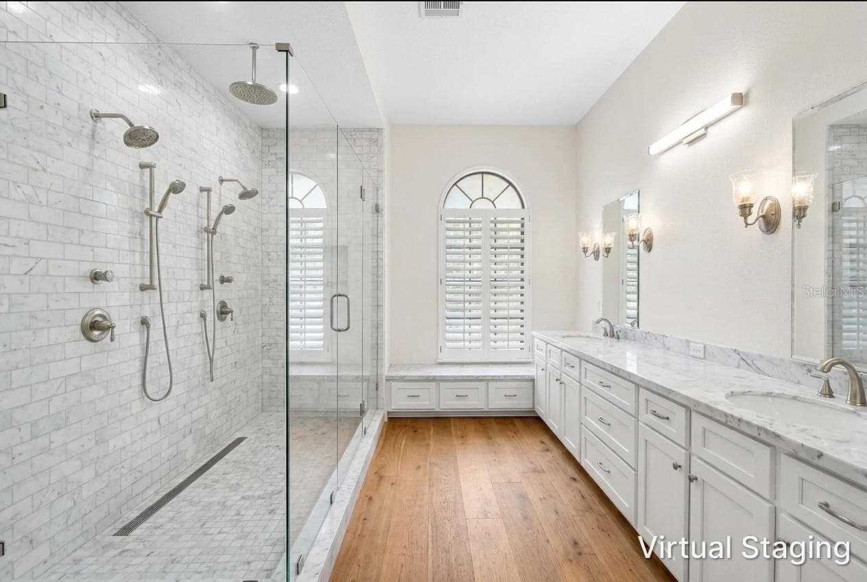 Virtual update to Primary bath using Previous photo. virtual new vanity, flooring, paint, and shower with glass walls instead of closed walls - 1186 GASPARILLA DR NE, ST PETERSBURG