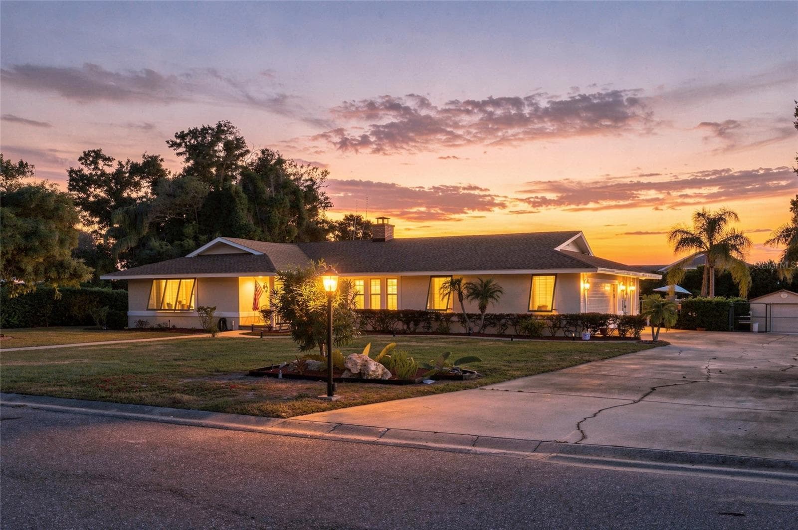 Side of home/ garage at sunset - 13205 MARIA AVE, CLERMONT