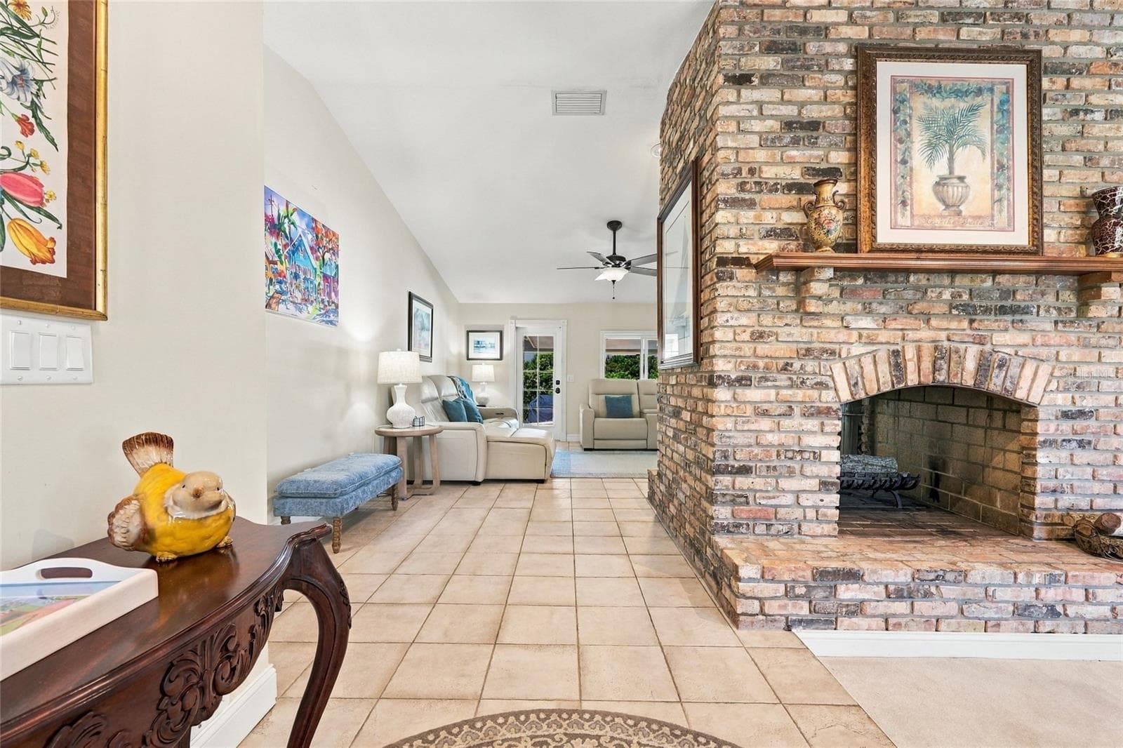 Front entrance with view of see through fireplace - 13205 MARIA AVE, CLERMONT