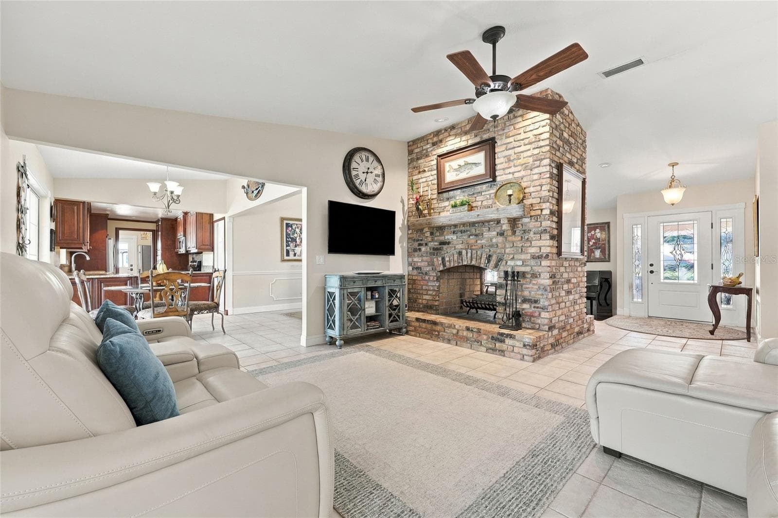 Family room with wood burning fireplace - 13205 MARIA AVE, CLERMONT