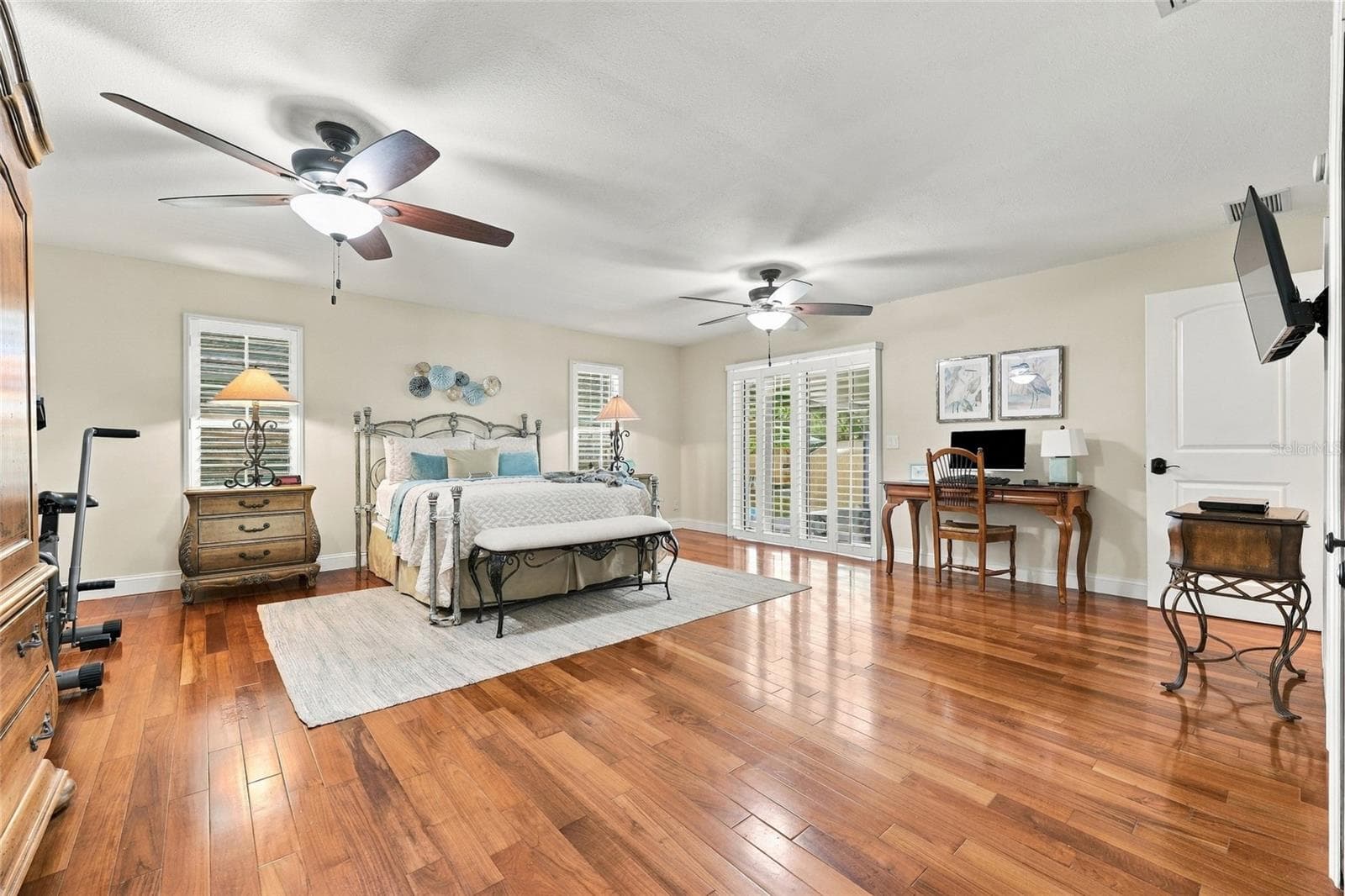 Primary bedroom with doors out to lanai - 13205 MARIA AVE, CLERMONT