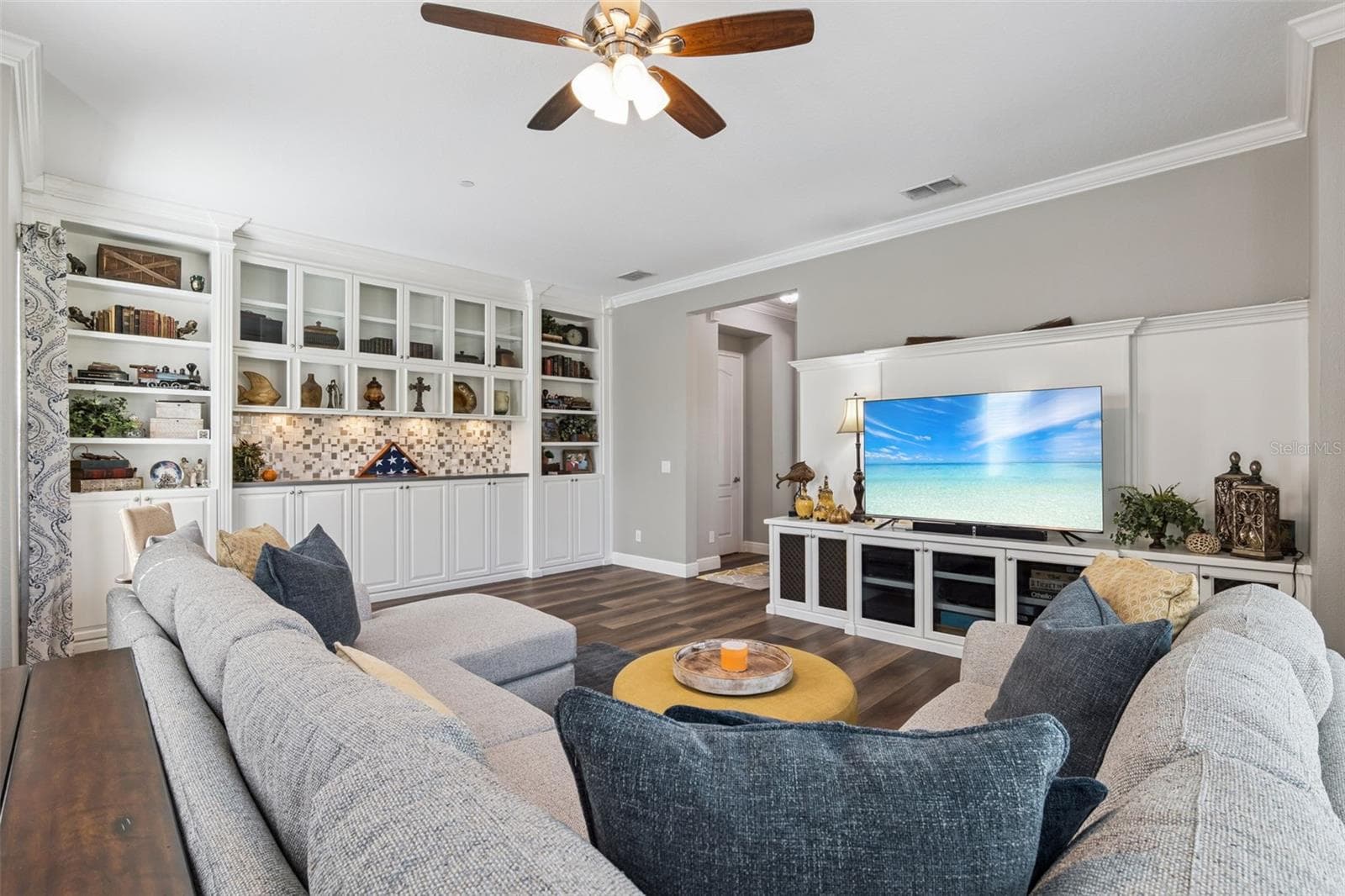 Living room with added shelves and entertainment area - 900 LOBELIA DR, LAKE MARY