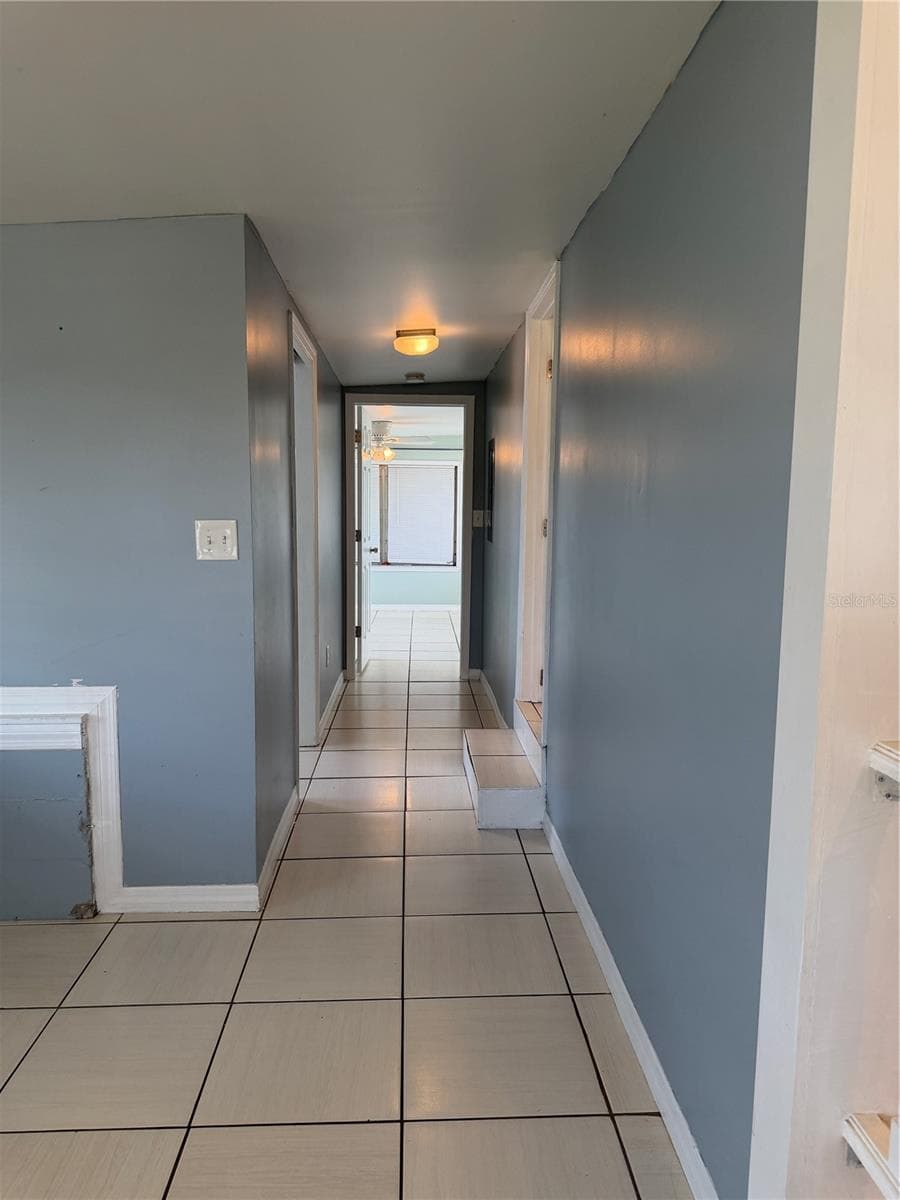 Hallway view to the primary bedroom. - 4120 BUENA VISTA LN, HOLIDAY