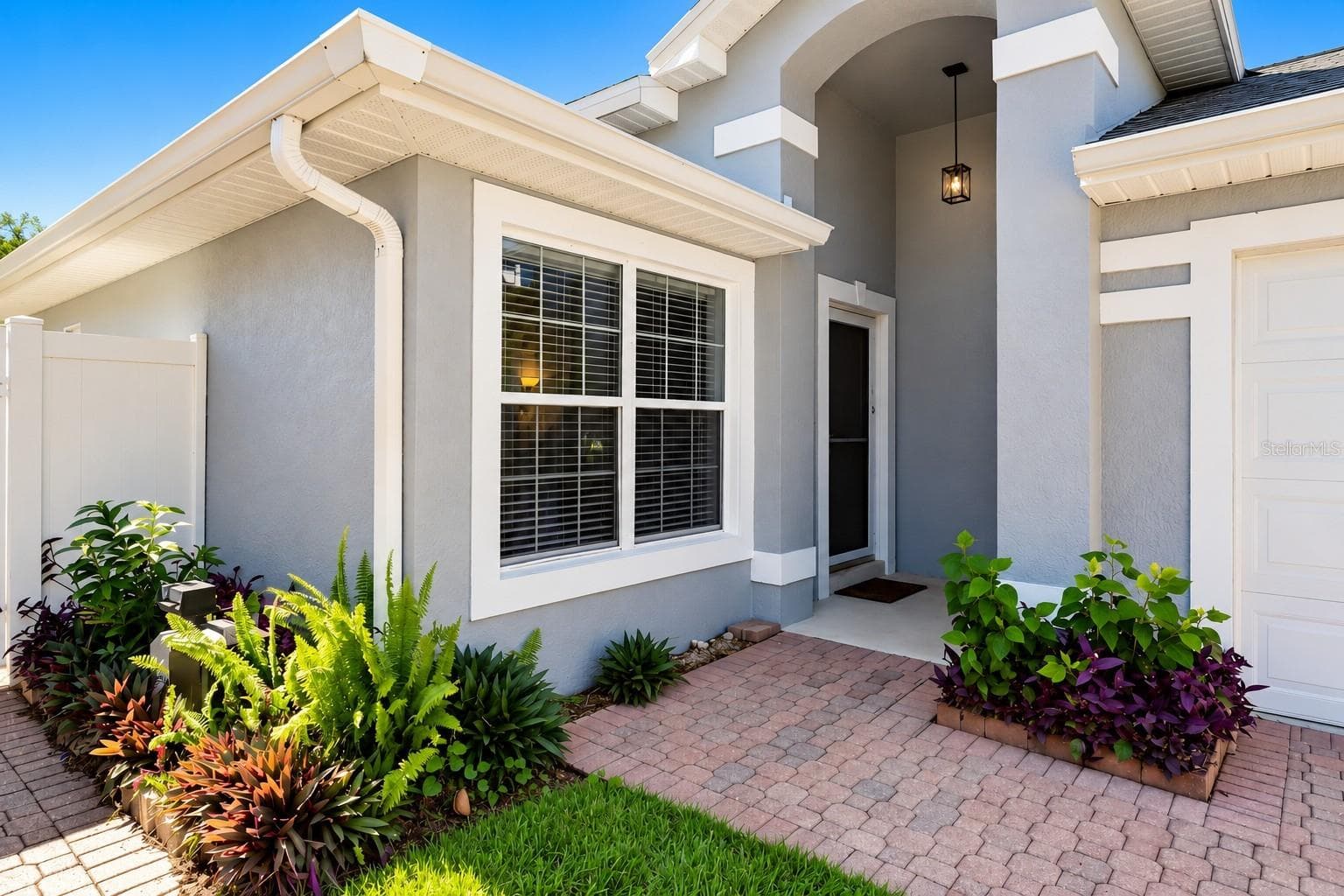 Charming covered entrance with glass storm door - 3437 GRENVILLE DR, WINTER HAVEN