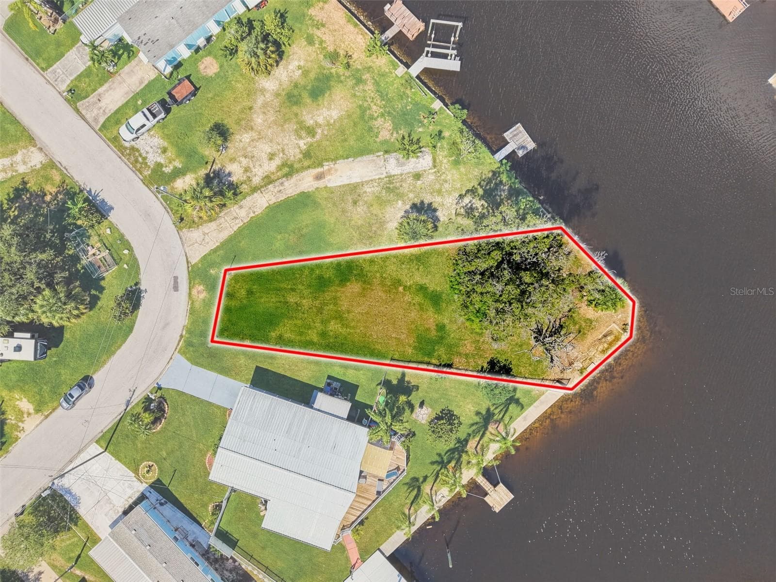 PREVIOUSLY IMPROVED LOT! Public water, sewer, and electric connections were previously installed - 13124 CABIN CT, HUDSON