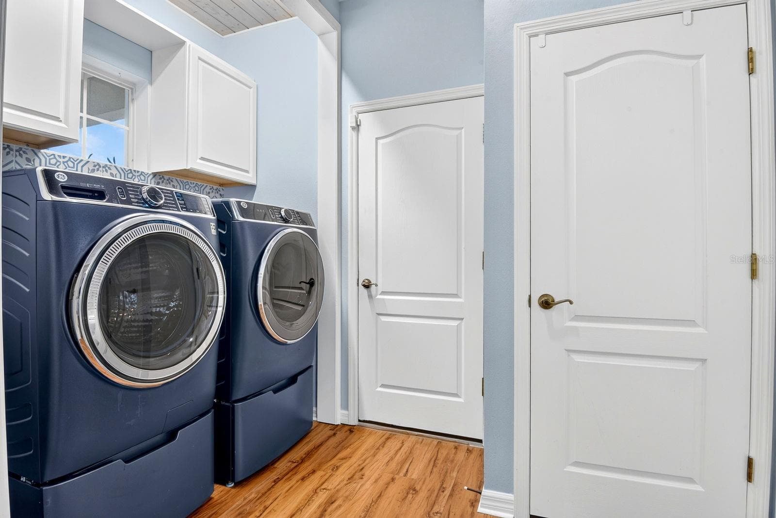 Laundry area by guest bedroom and garage door - 5312 AQUA BREEZE DR, BRADENTON