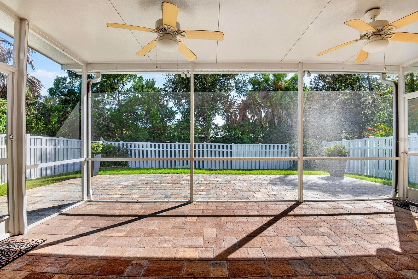 Large screened in Lanai facing out with extended pavers outside - 5312 AQUA BREEZE DR, BRADENTON