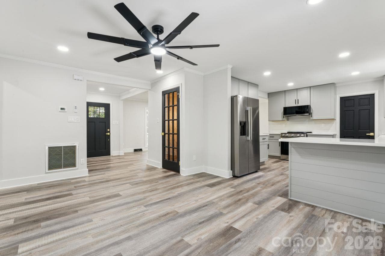 Dining area into kitchen - 4908 Zephyr Lane, Charlotte
