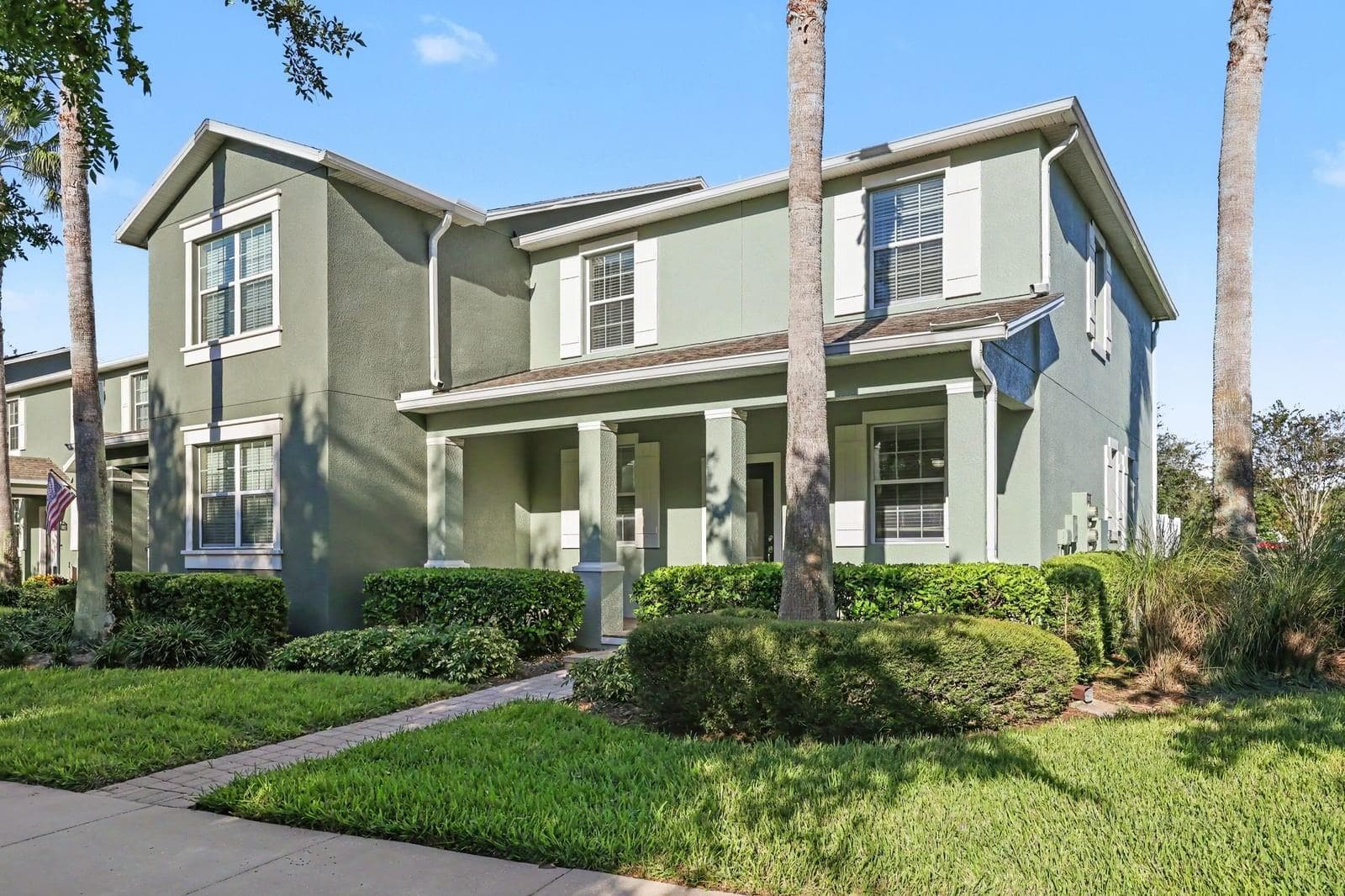 Elegant home featuring gabled roofline and mature landscaping - 5705 NEW INDEPENDENCE PKWY, WINTER GARDEN