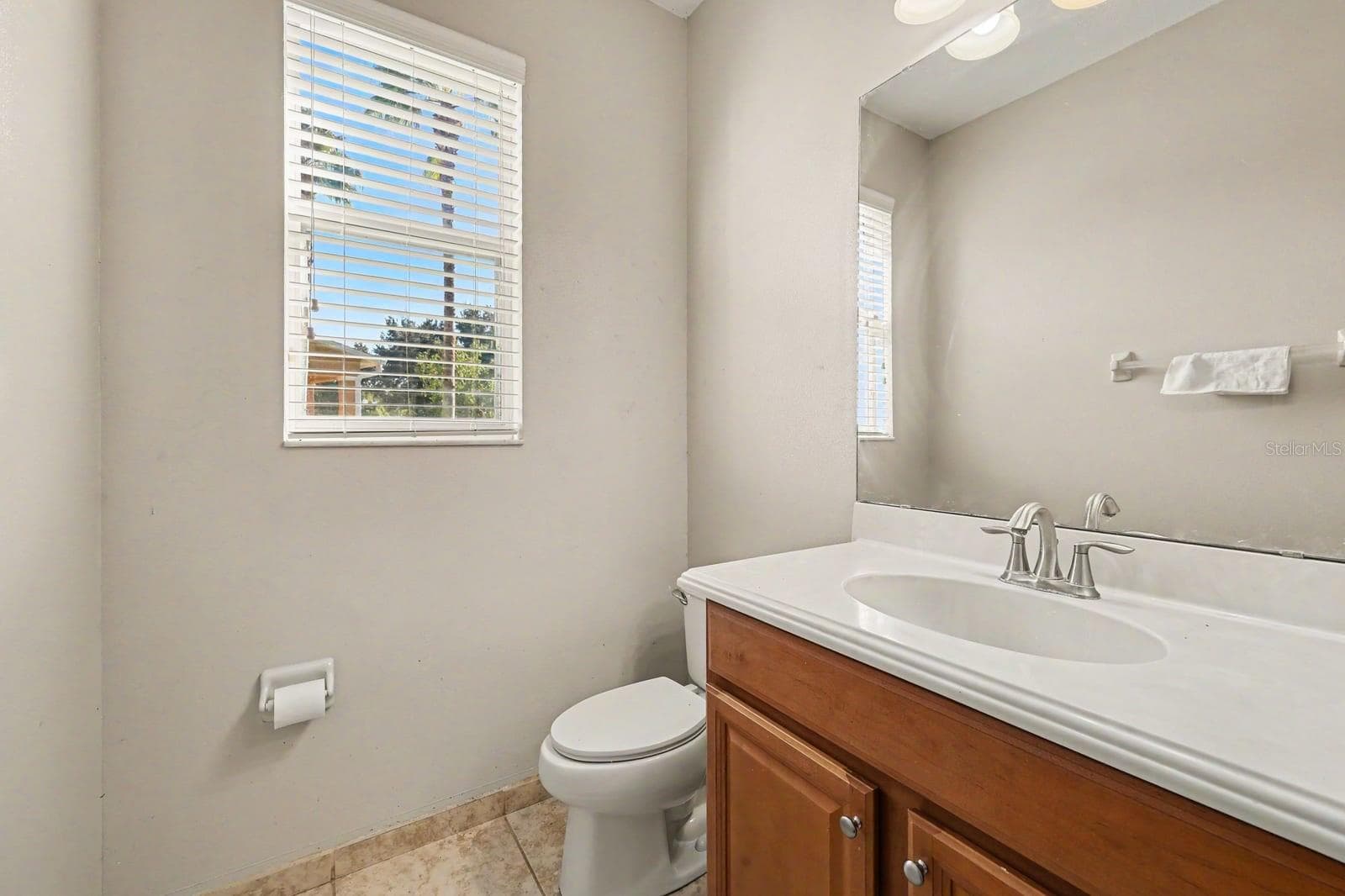Master Bath Features Wood Vanity, Granite Countertop & Window Light - 5705 NEW INDEPENDENCE PKWY, WINTER GARDEN
