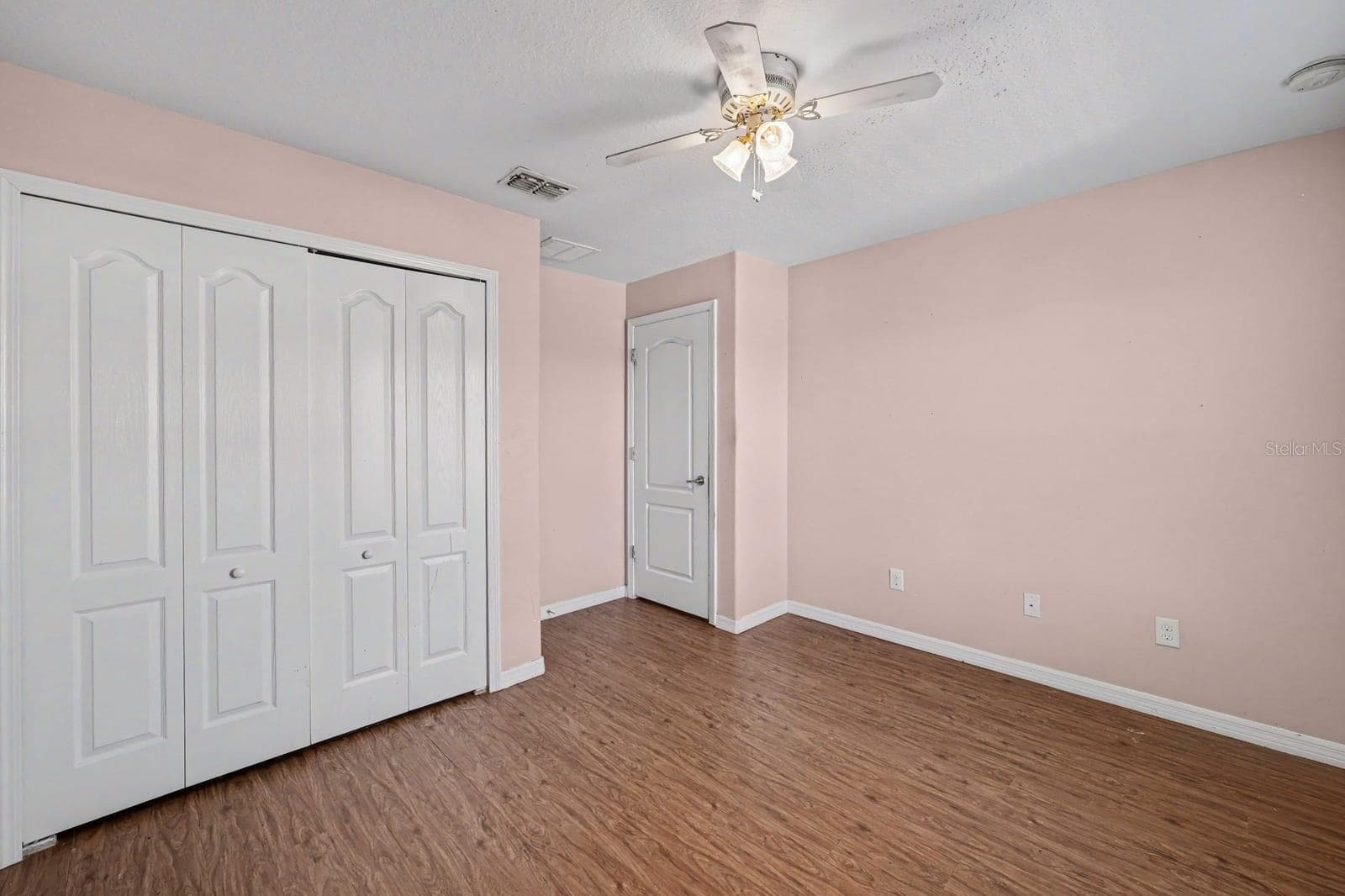 Master Bedroom with Multiple Closets, Windows & Wood Flooring - 5705 NEW INDEPENDENCE PKWY, WINTER GARDEN