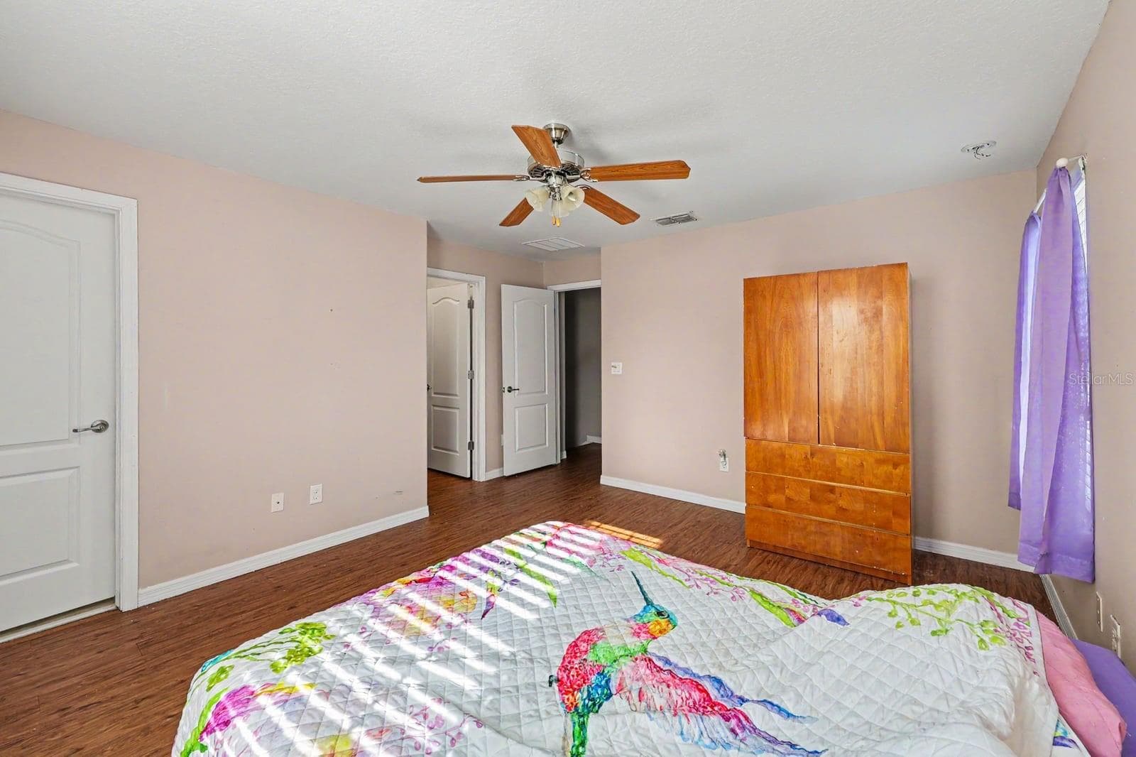 Master Suite with Walk-In Closets, Multiple Doors & Wood Flooring - 5705 NEW INDEPENDENCE PKWY, WINTER GARDEN