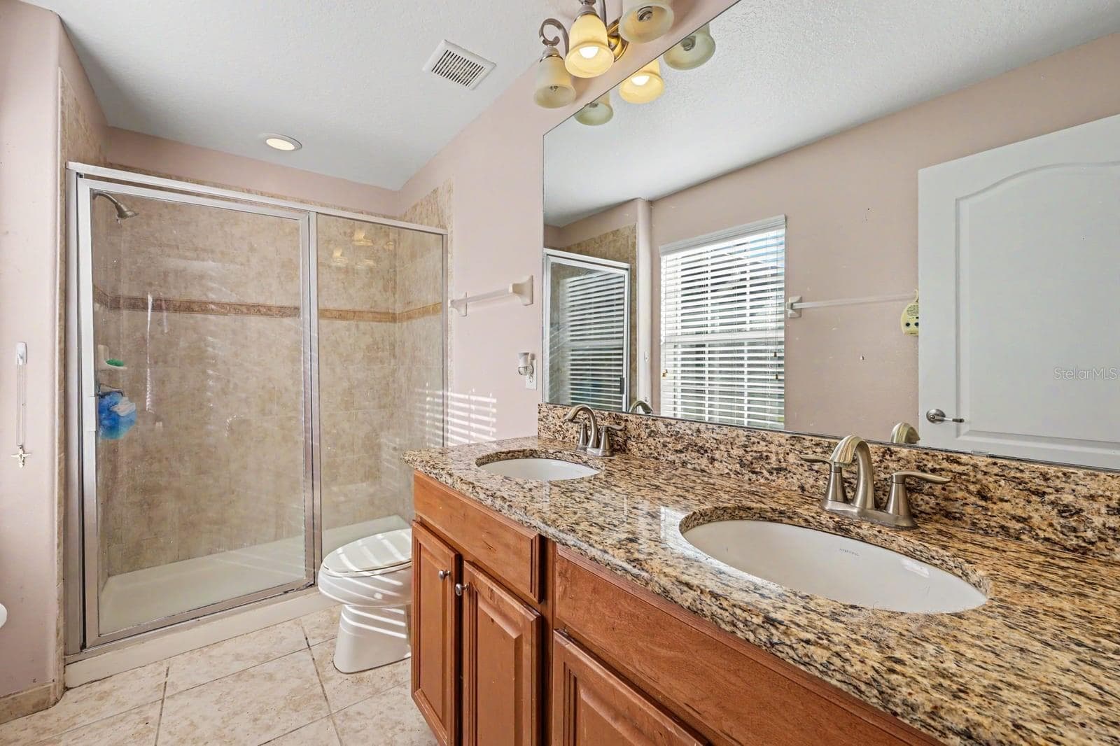 Spa-like Master Bath with Dual Vanities, Granite Countertops & Spacious Walk-In Shower - 5705 NEW INDEPENDENCE PKWY, WINTER GARDEN