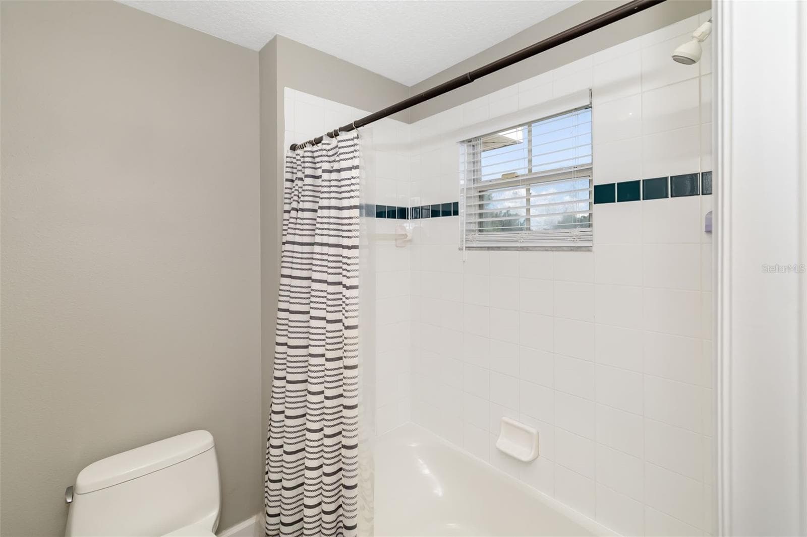 Bathroom 3 - Tub/Shower, with door that closes for privacy from vanity area - 124 41ST CIR E, BRADENTON