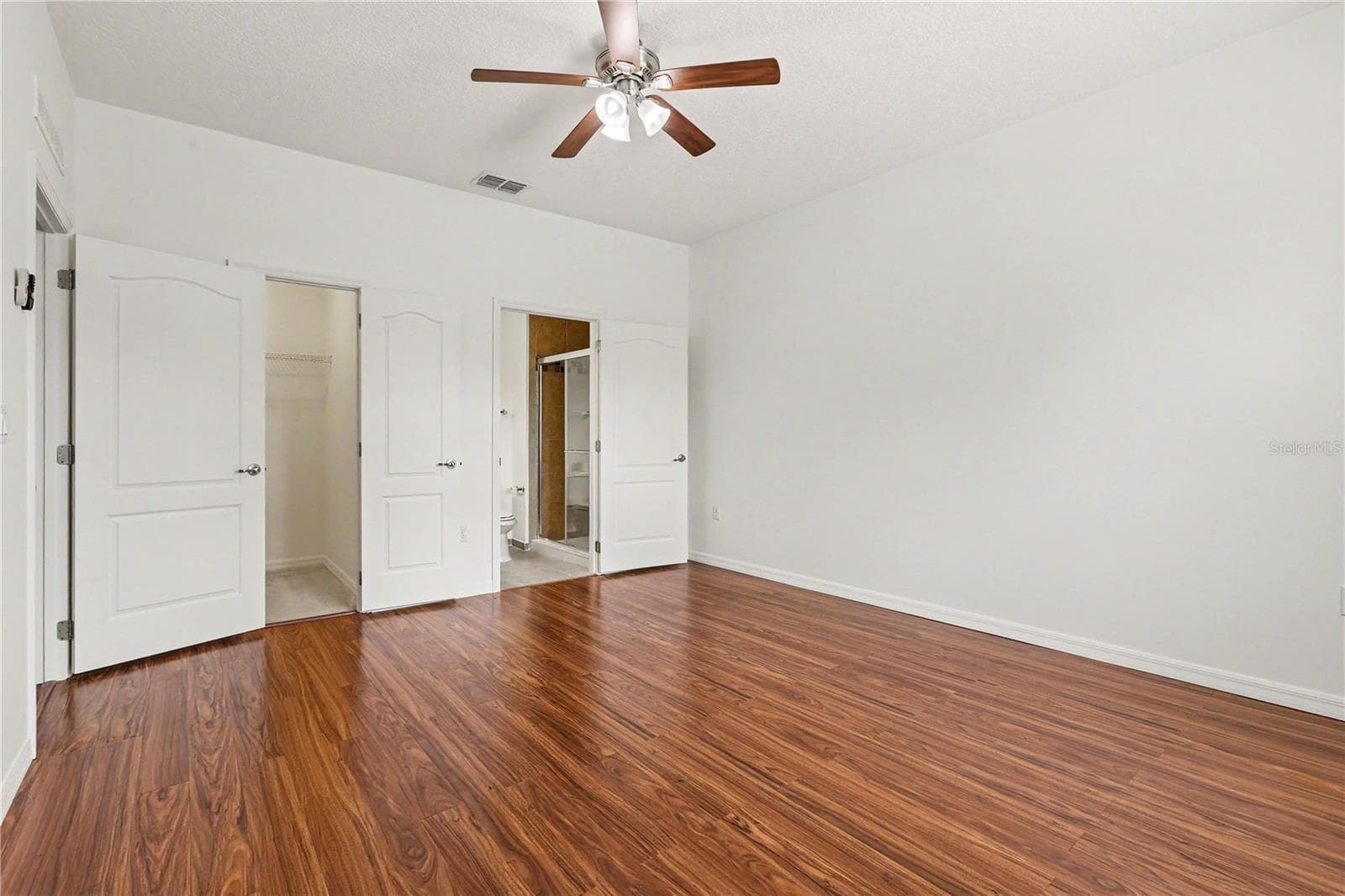 Master Bedroom Suite with vinyl Floors and Ample Closet Space on main floor - 580 L M DAVEY LN, TITUSVILLE
