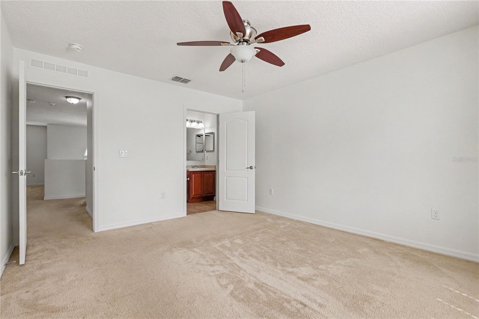 bedroom with bathroom - 580 L M DAVEY LN, TITUSVILLE