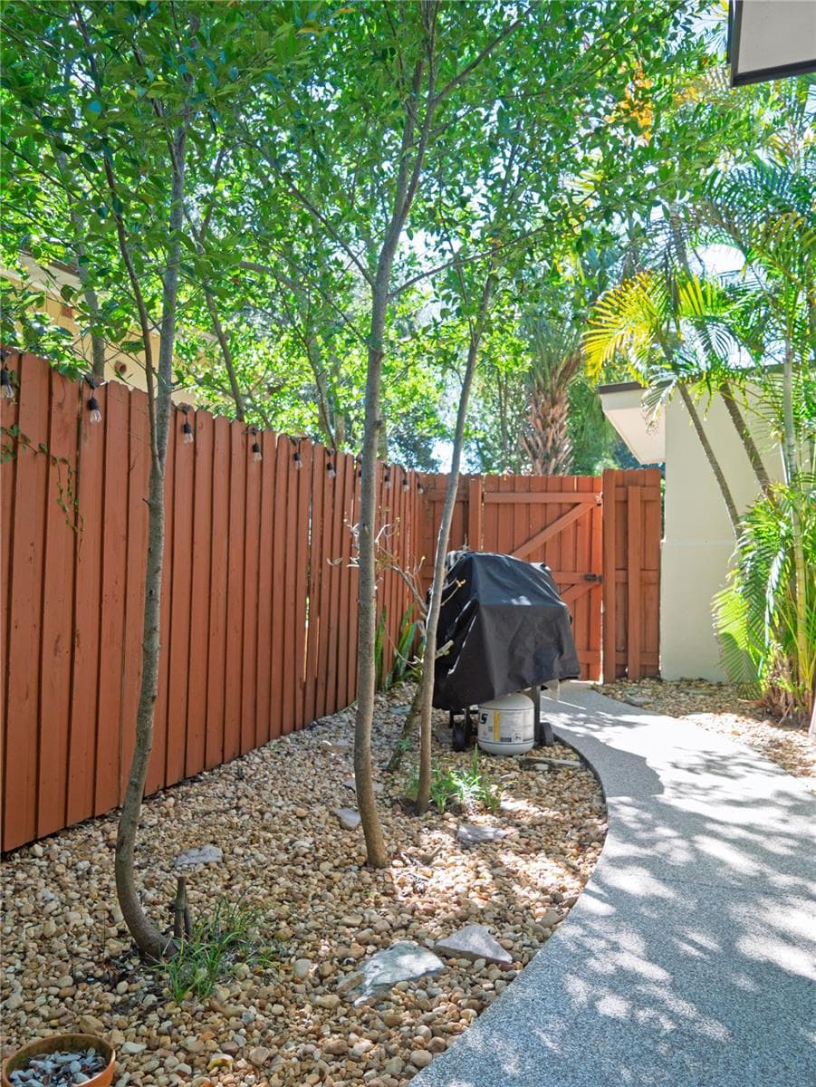 Side Lot outside of the Screened in Porch / BBQ Area - 767 17TH AVE N, ST PETERSBURG