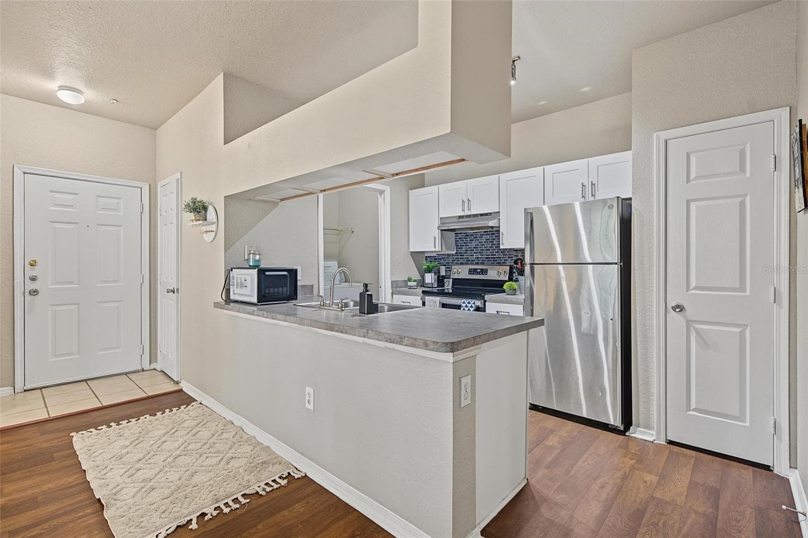 Kitchen Overlooking Living Room - 13123 Sanctuary Cove Drive - Unit 104 - 13123 SANCTUARY COVE DR #104, TEMPLE TERRACE