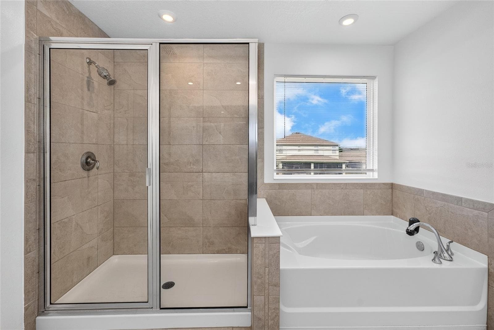 Primary bathroom shower and tub 2 - 2960 ANGELONIA THORN WAY, CLERMONT