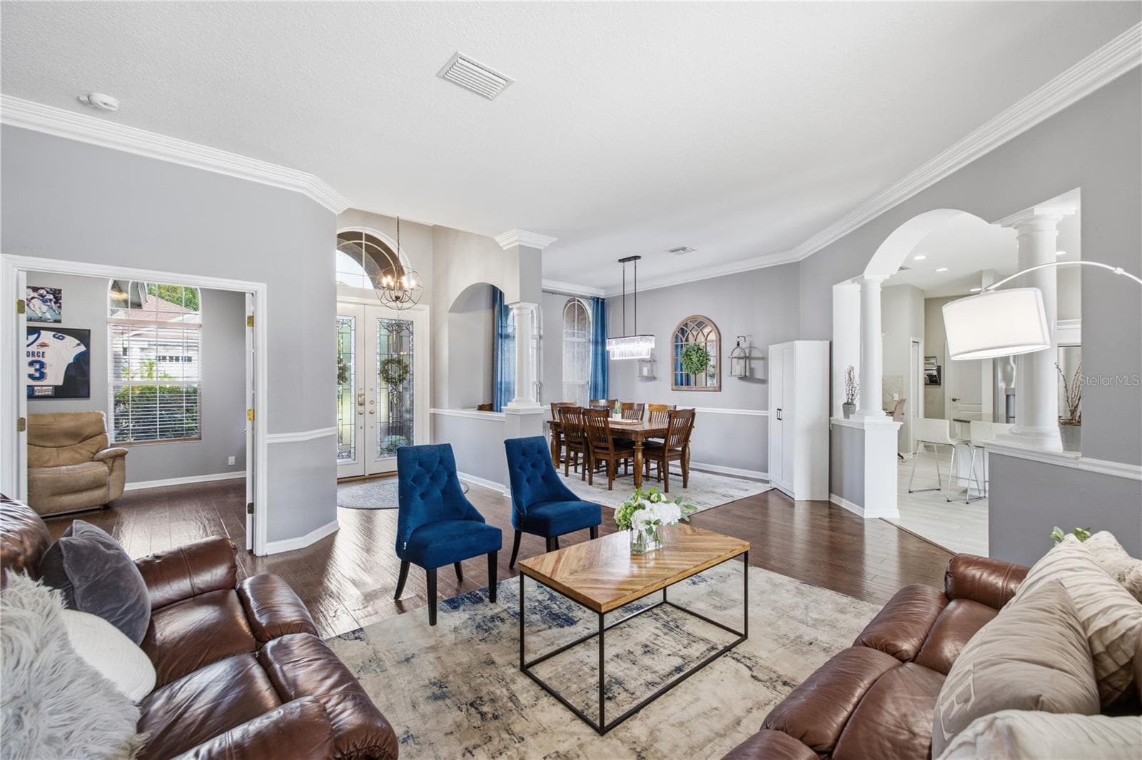 Den at the entry of the home, next to the home office and dining area! - 3905 SORREL VINE DR, WESLEY CHAPEL