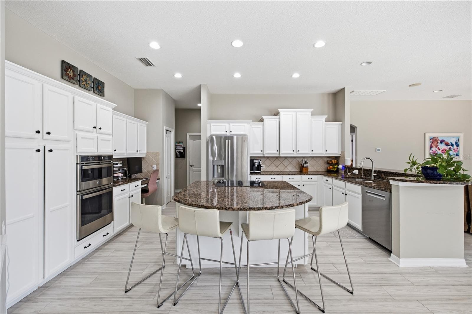 Huge kitchen with customized storage solutions in cabinets. - 3905 SORREL VINE DR, WESLEY CHAPEL