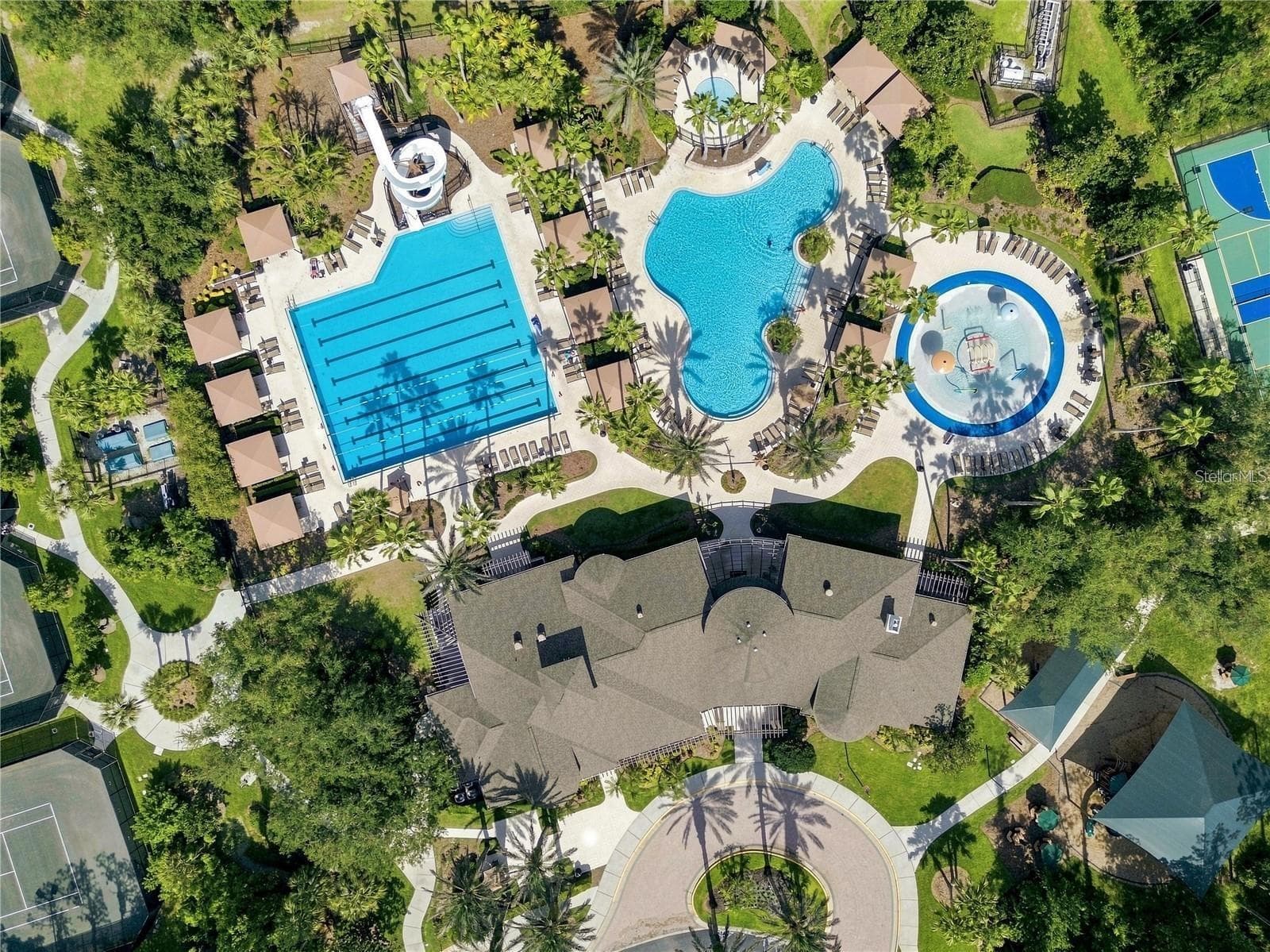 Luxury Amenities: A Resort-Style Pool: Complete with a sun deck, lounge chairs, and a double-loop waterslide.A Junior-Olympic Lap Pool: Designed for swimming laps and exercise.A Wading Pool: A shallow pool area perfect for younger children.A Splash Park / Children's Water Park - 3905 SORREL VINE DR, WESLEY CHAPEL