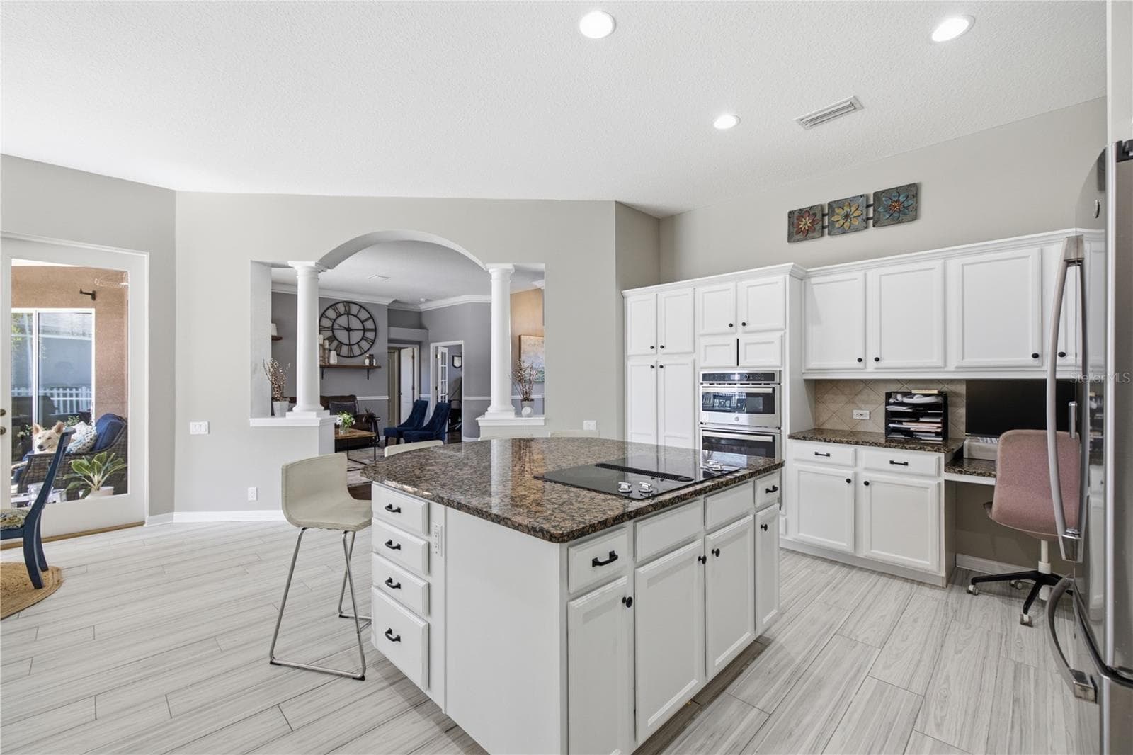 Kitchen Island and Cook top with work station on far side counter area built in. - 3905 SORREL VINE DR, WESLEY CHAPEL