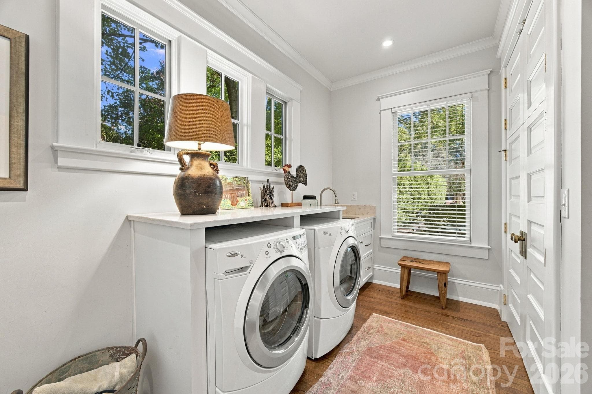 Laundry room with storage closet and access to side porch - 1912 Park Road, Charlotte