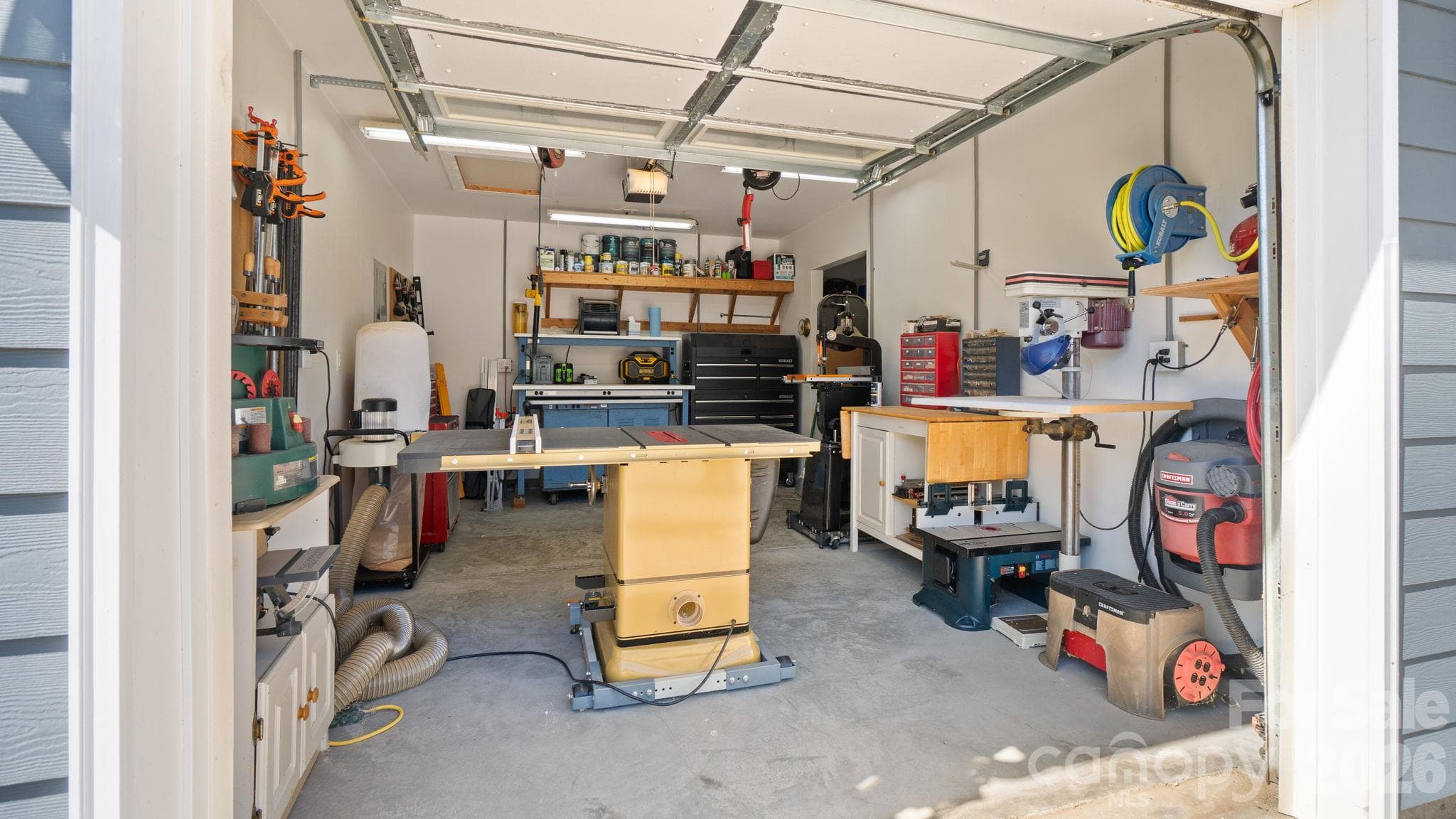 Third car garage! Currently being used as a workshop...plus utility sink! - 1232 New River Drive, Concord