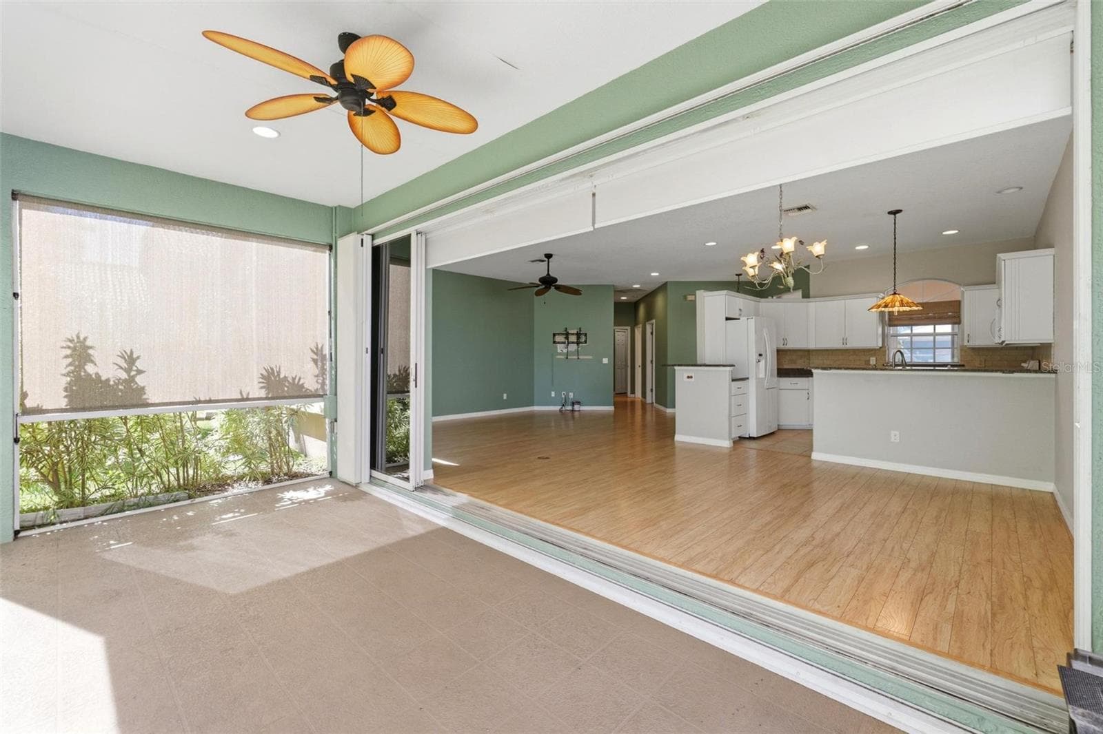 Lanai with pocketing sliders to expand the living area - 26341 SEMINOLE LAKES BLVD, PUNTA GORDA