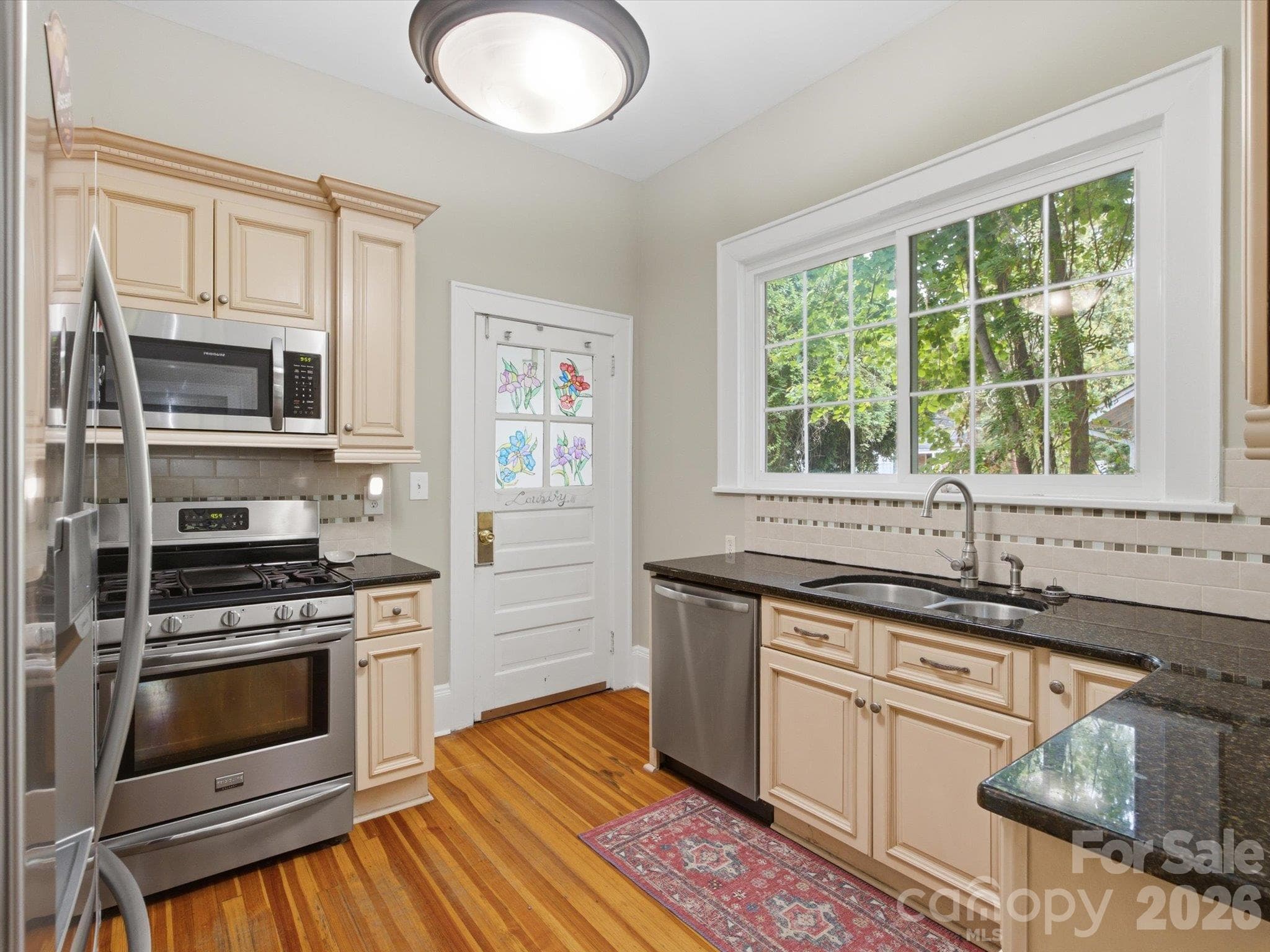 Kitchen Looking Toward the Laundry Room and Back Door. - 707 York Street, Gastonia
