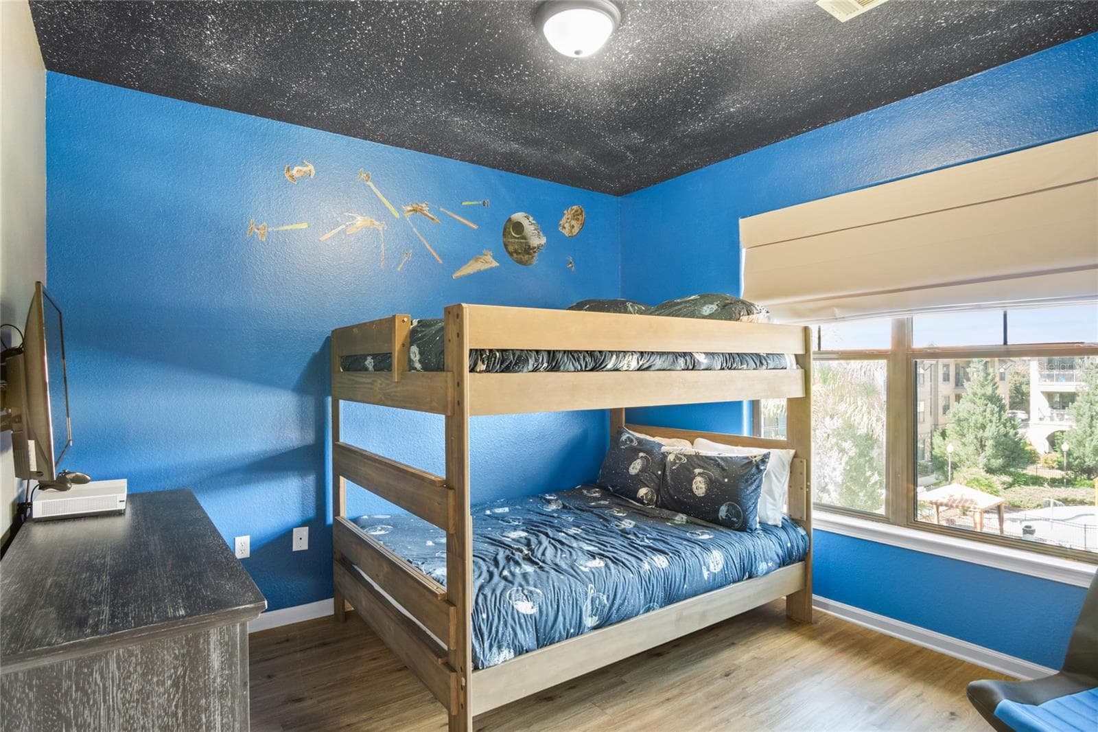 Bedroom 2 located in the rear of the unit, with view of the pool. - 912 CHARO PKWY #232, DAVENPORT