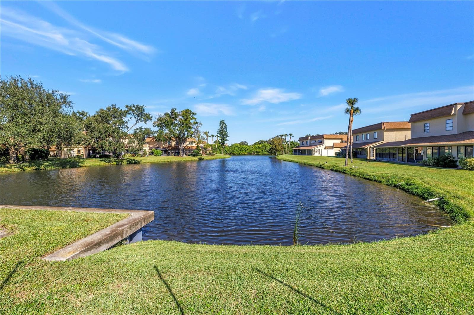 Located on scenic Cinnamon Lake - 8473 17TH ST N, ST PETERSBURG