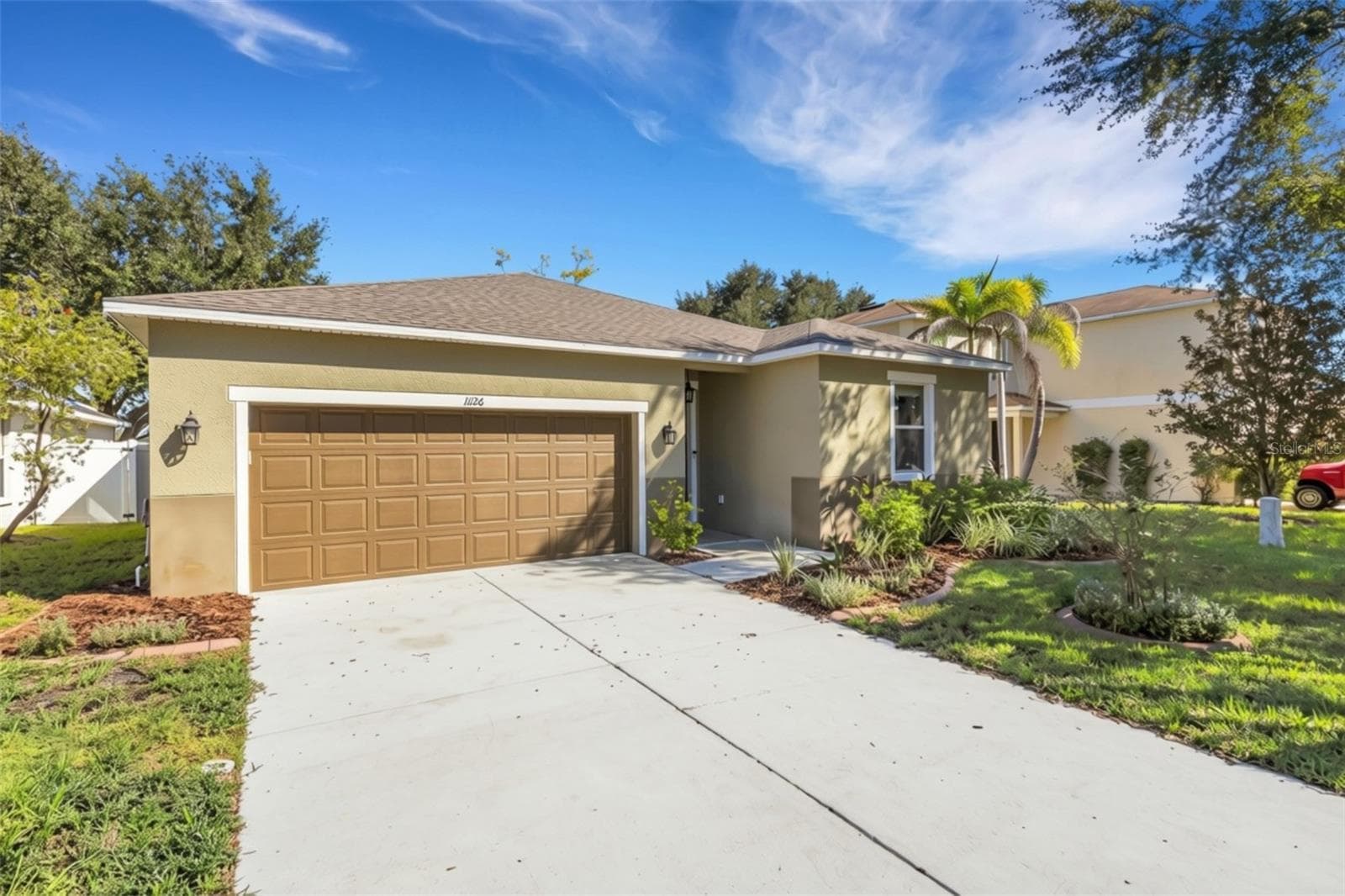 Front Elevation with Oversized Two Car Garage with Overhead Storage - 11126 GOLDENROD FERN DR, RIVERVIEW