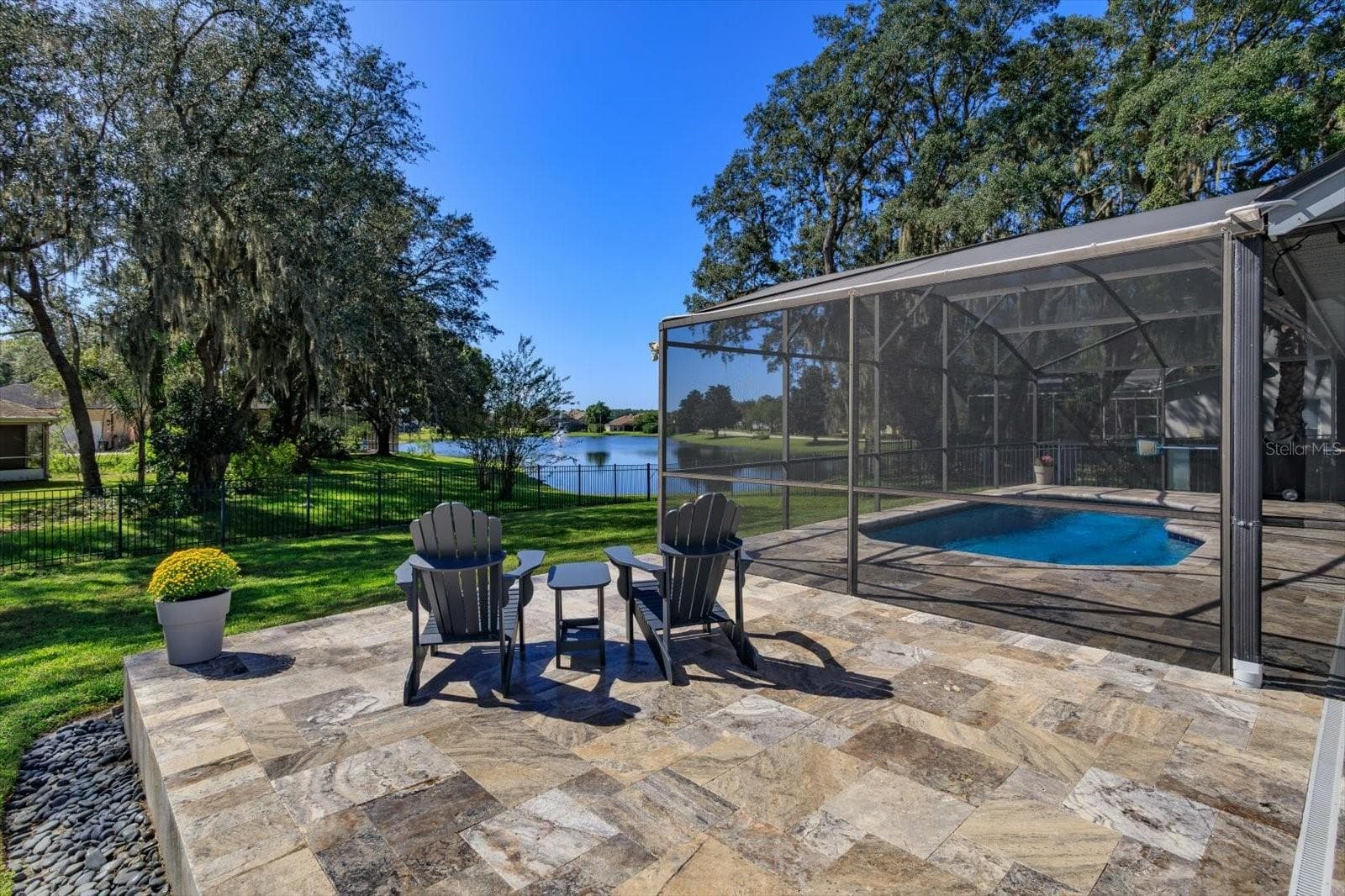 Open Travertine paver patio - 6887 HIDDEN GLADE PL, SANFORD