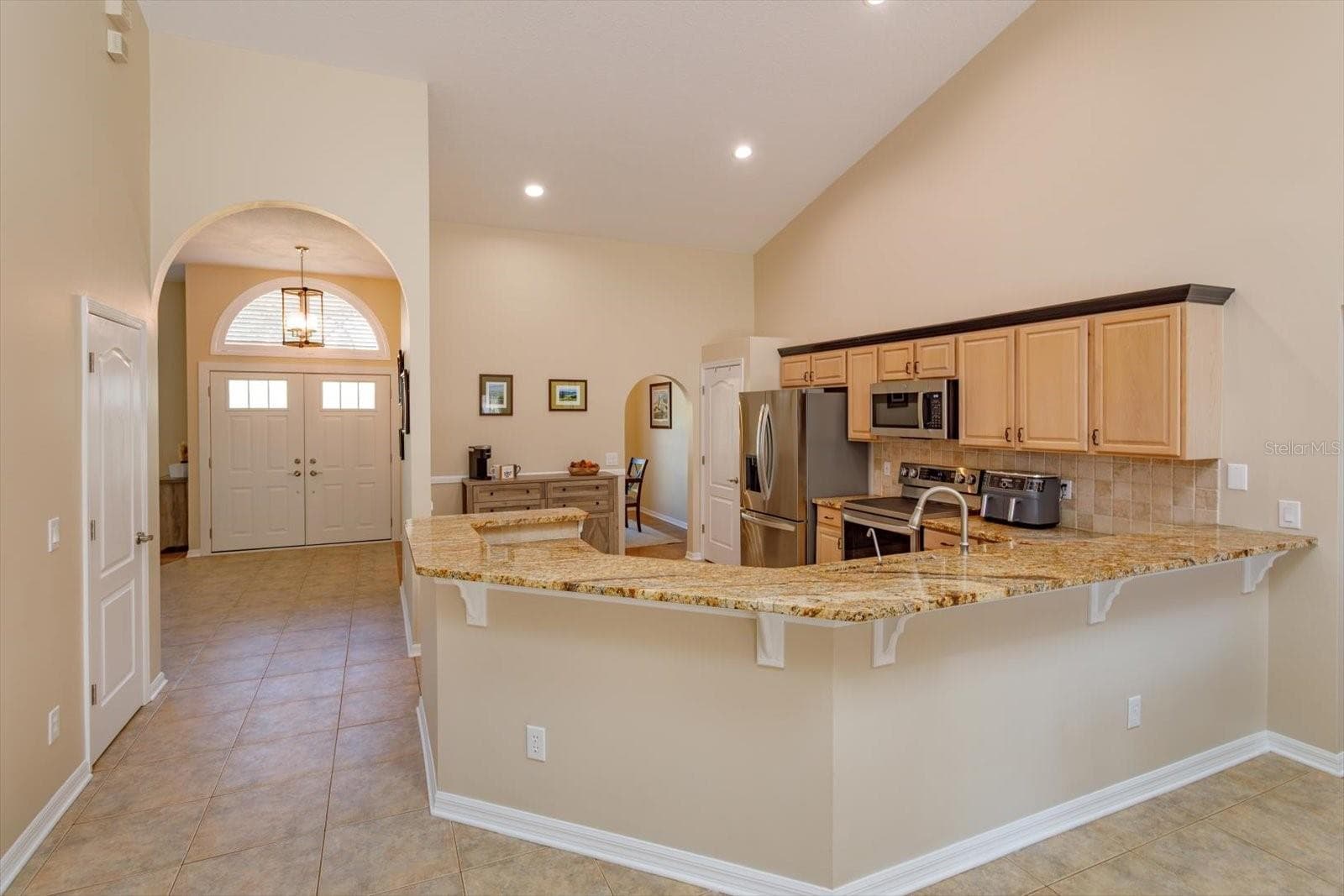 Expansive granite counters with backsplash - 6887 HIDDEN GLADE PL, SANFORD