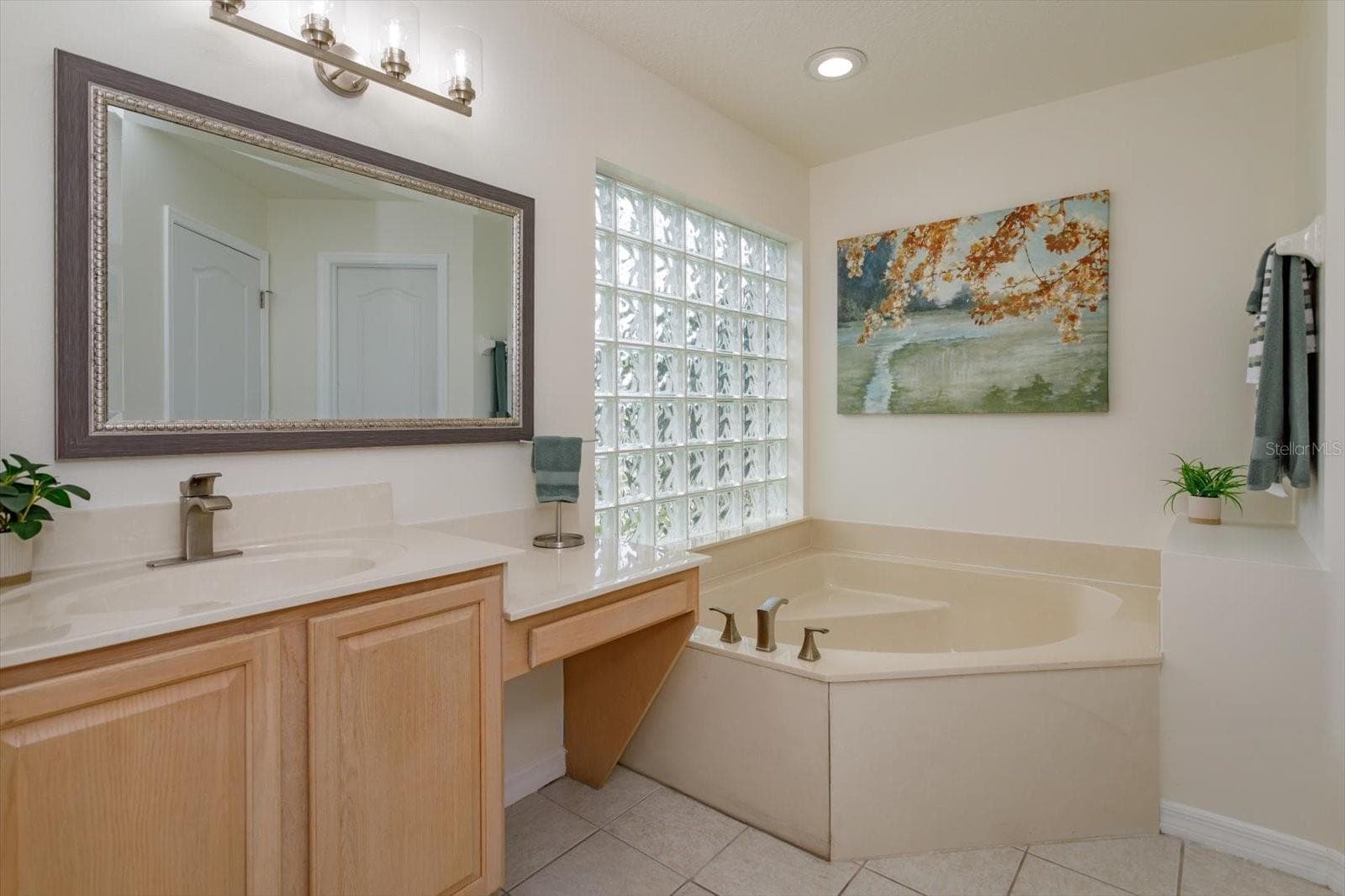Her primary bathroom features corner tub, knee space and private water closet - 6887 HIDDEN GLADE PL, SANFORD