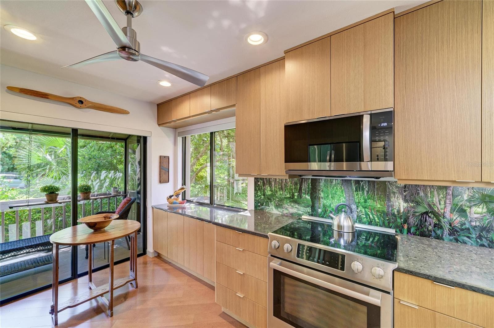 Backsplash is custom made - photo of the backyard - 2403 ARBORETUM CIR #29, SARASOTA