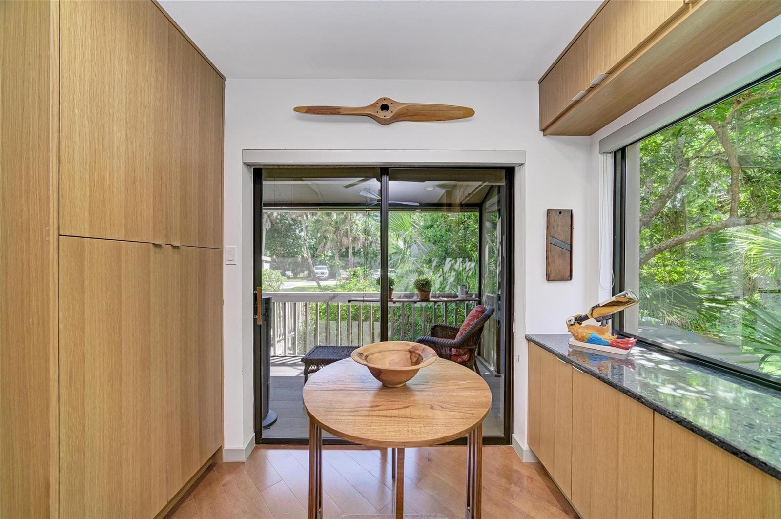 Washer/dryer and pantry in the closets to the left. And another large window looking out at your tropical oasis. - 2403 ARBORETUM CIR #29, SARASOTA