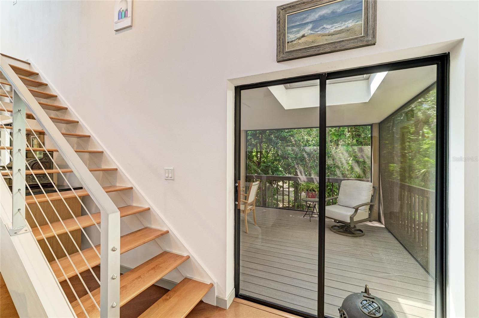 Sliders out to the lanai and stairs to the loft - 2403 ARBORETUM CIR #29, SARASOTA